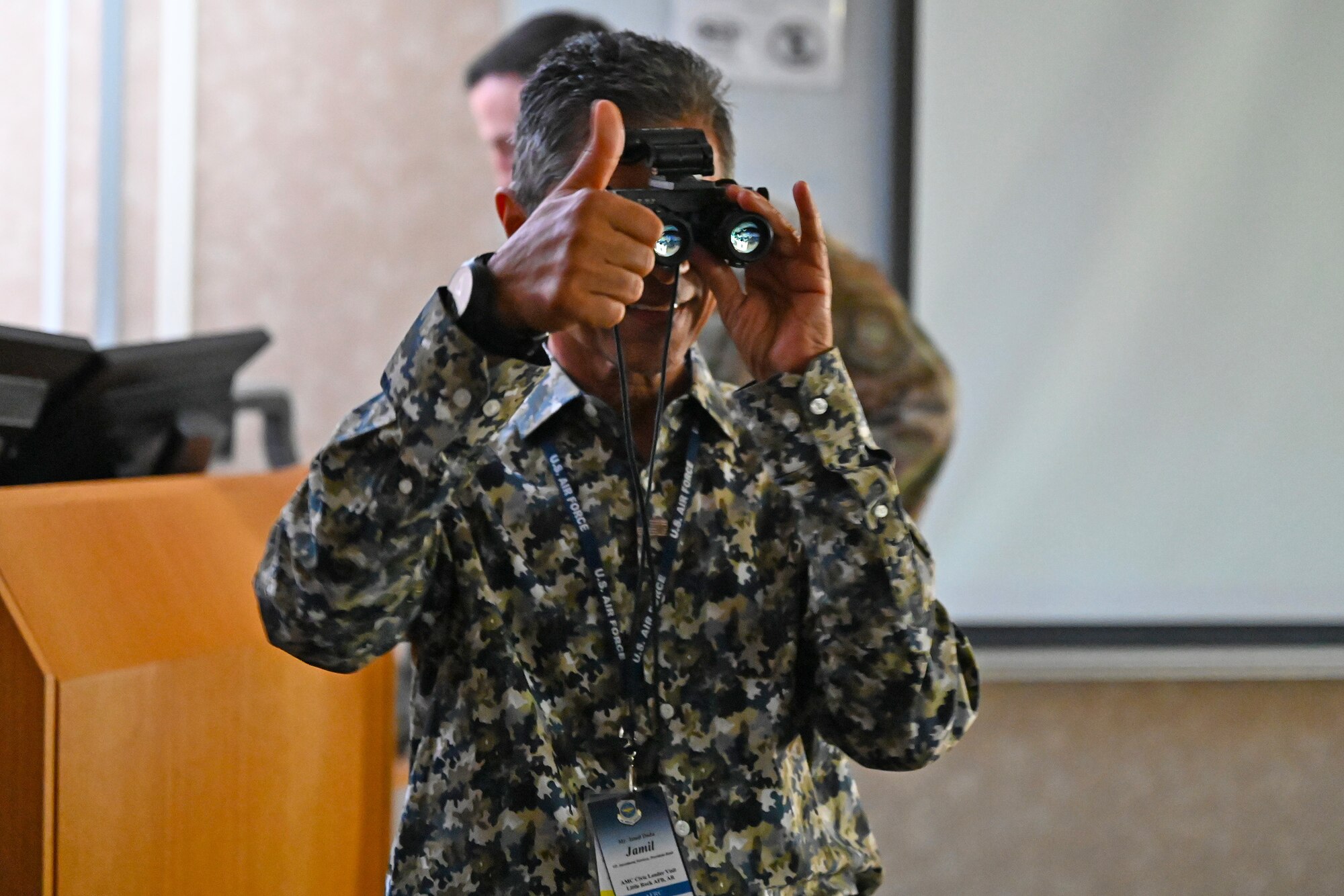 Jamil Dada, Air Mobility Command Civic Leader representing Air Force Reserve Command, tests new night vision googles