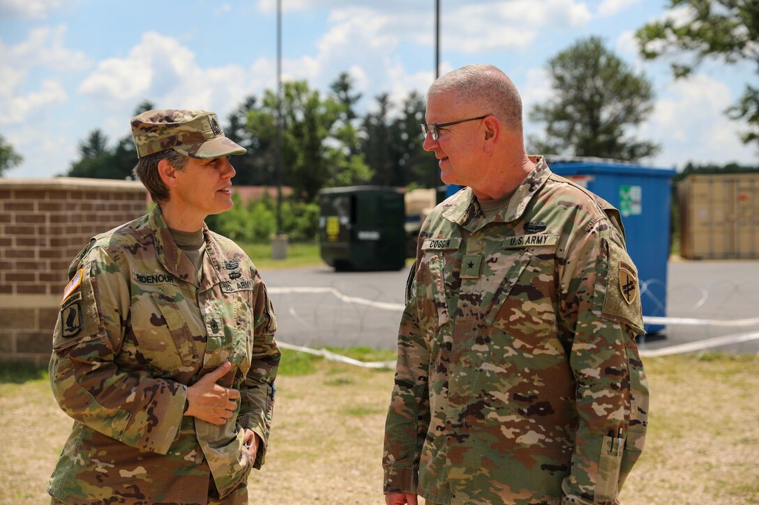 U.S. Army Reserve Sgt. Major Rachael K. Ridenour, operations sergeant major, 358th Civil Affairs Brigade, conducts a brief to Brig. Gen. Jeffrey C. Coggin, commanding general, U.S. Army Civil Affairs and Psychological Operations Command (Airborne) on unit combat operations during Command Post Exercise – Functional (CPX-F) 21-02 at Fort McCoy, Wis., June 10, 2021.