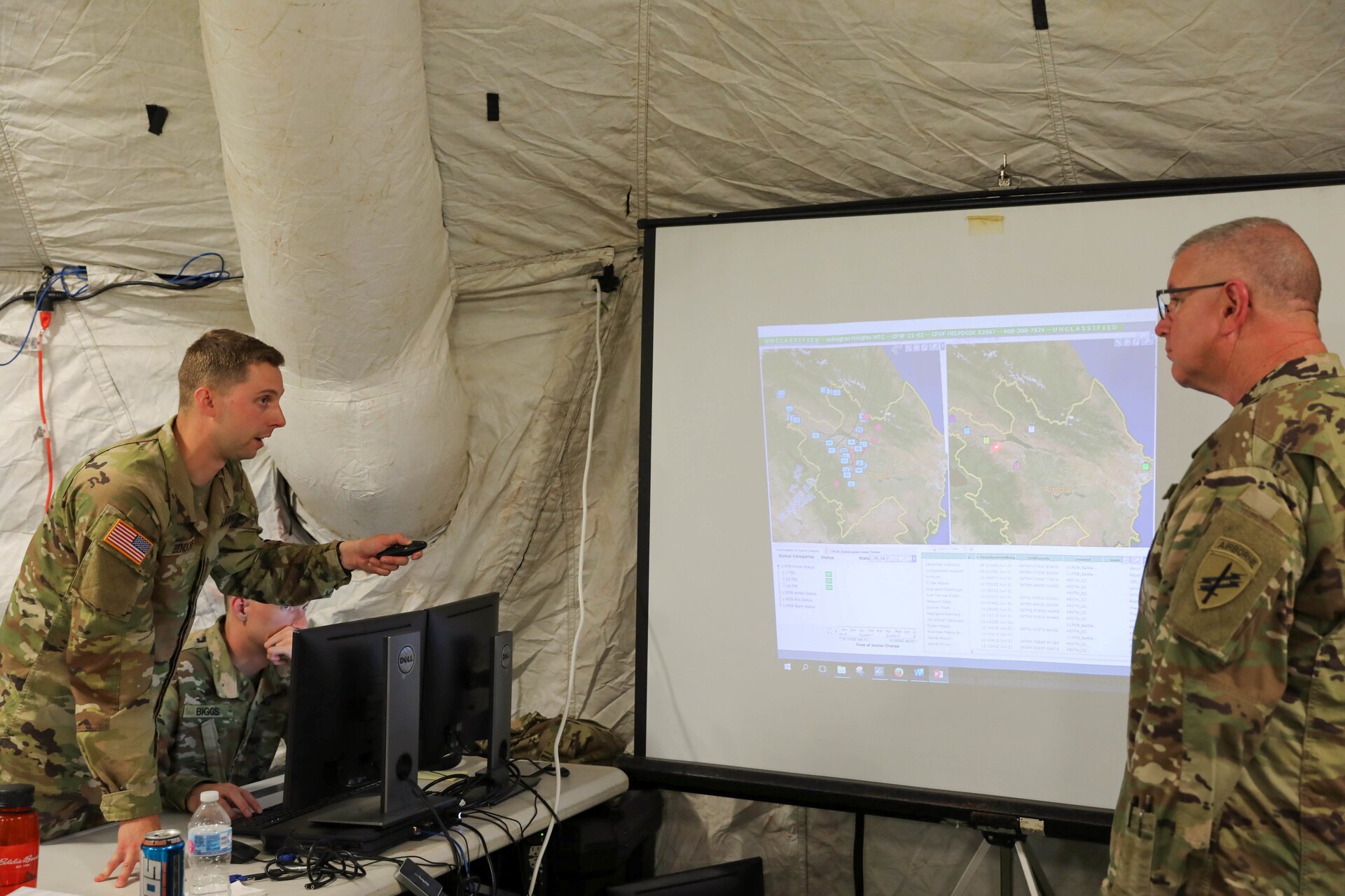 U.S. Army Reserve Spc. Zachary H. Bendorf, psychological operations specialist, 11th Psychological Operations Battalion, briefs Brig. Gen. Jeffrey C. Coggin, commanding general, U.S. Army Civil Affairs and Psychological Operations Command (Airborne), using the Command Post of the Future (CPOF) platform. Bendorf is able to brief the commanding general on battlefield topsight, collaboration and live data using this system at Command Post Exercise – Functional (CPX-F) at Fort McCoy, Wis., June 10, 2021.