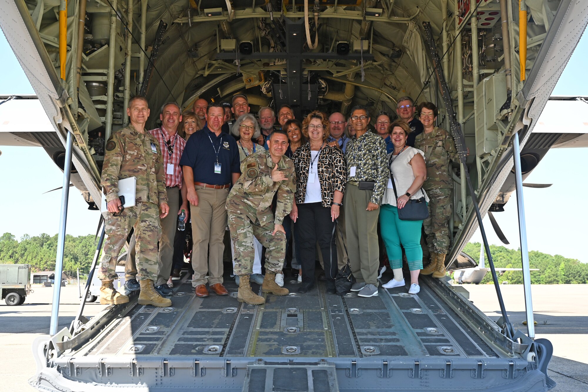 Gen. Jacqueline Van Ovost, Air Mobility Command commander, far right, and Chief Master Sgt. Brian Kruzelnick, AMC command chief, center, gather with AMC Civic Leaders