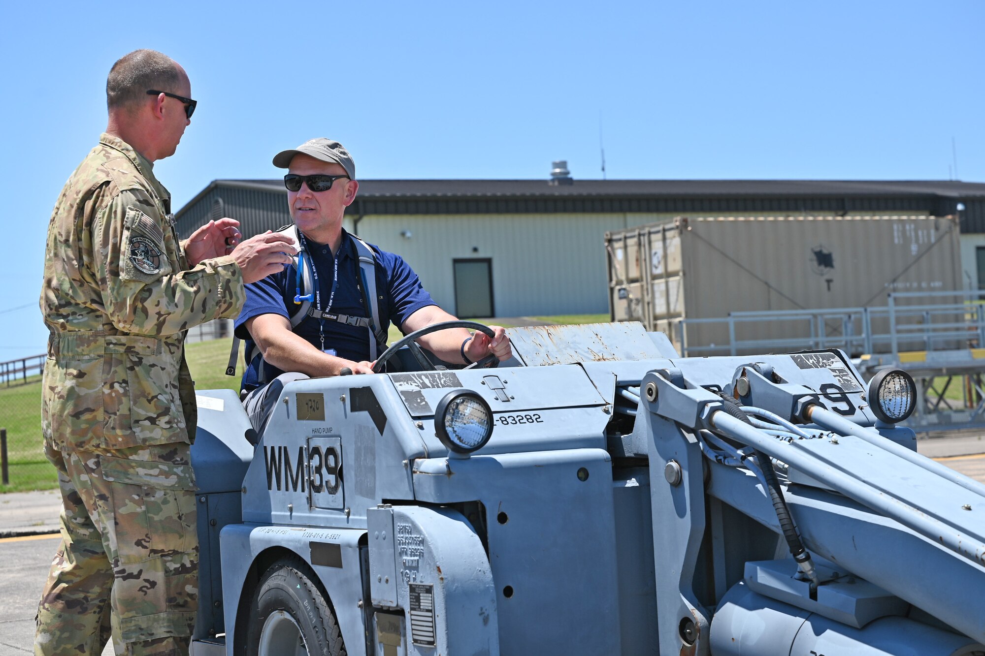 Mark Lillis, Air Mobility Command Civic Leader representing Travis Air Force Base, California, drives a bomb lifter while touring the 34th Combat Training Squadron