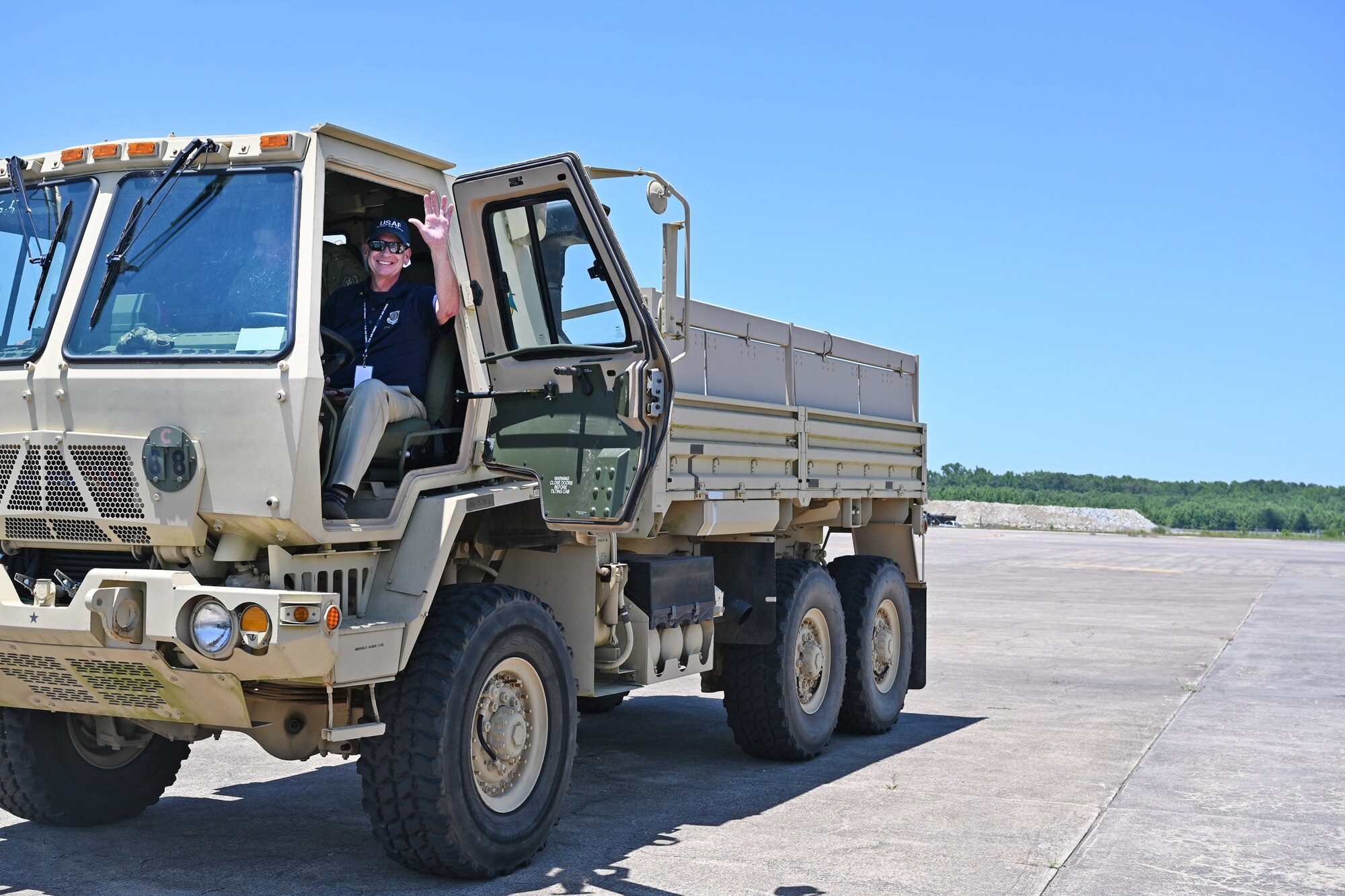 Kevin Twohig, Air Mobility Command Civic Leader representing Fairchild Air Force Base, Washington, drives a tactical vehicle while touring the 34th Combat Training Squadron