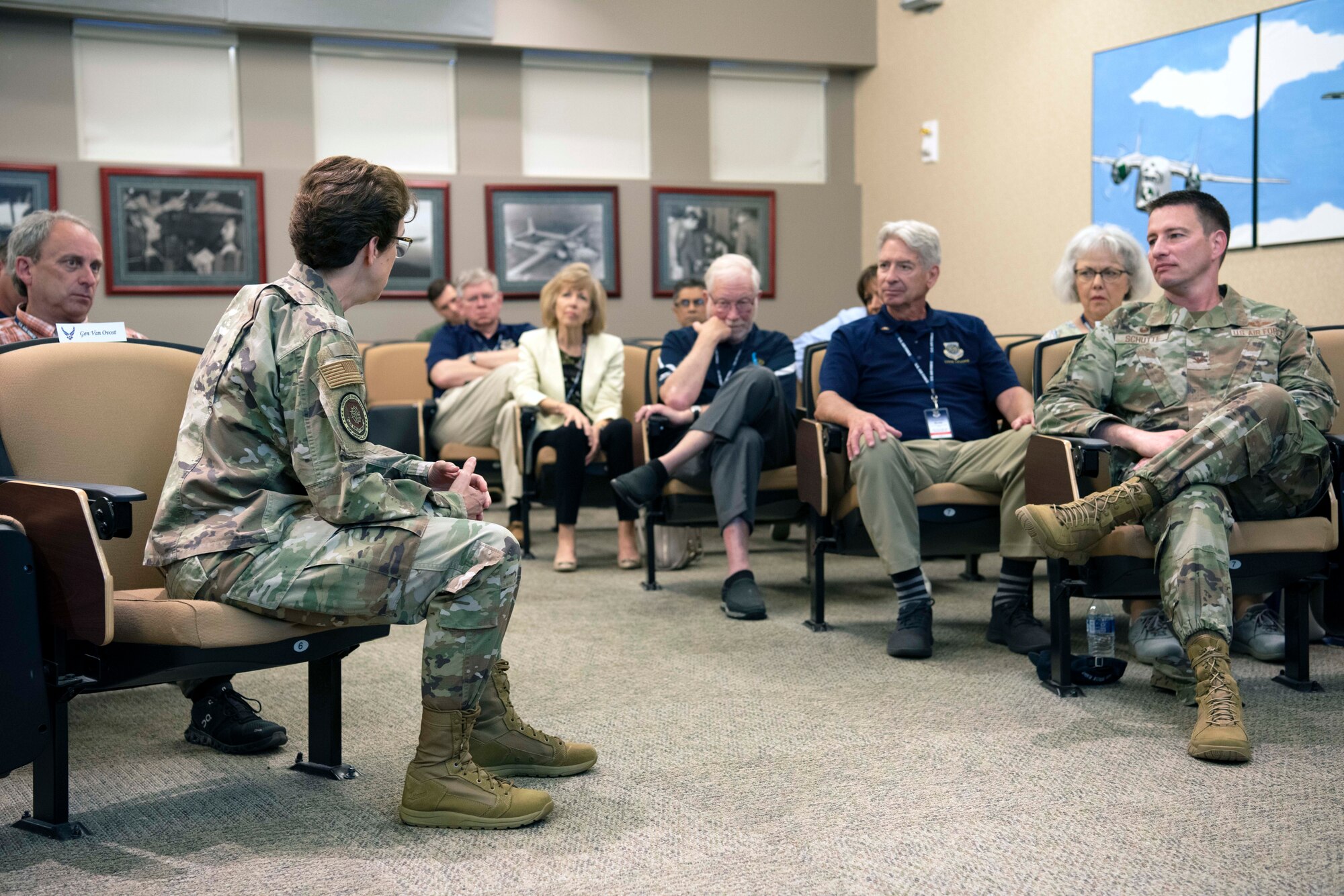 Gen. Jacqueline Van Ovost, Air Mobility Command commander, left, and Col. John Schutte, 19th Airlift Wing commander, right, discuss the 19th AW’s advancement of warfighting initiatives with AMC Civic Leaders