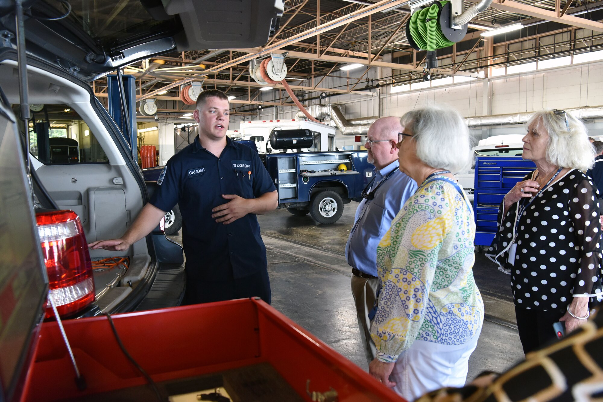 Air Mobility Command Civic Leaders tour the vehicle maintenance facility