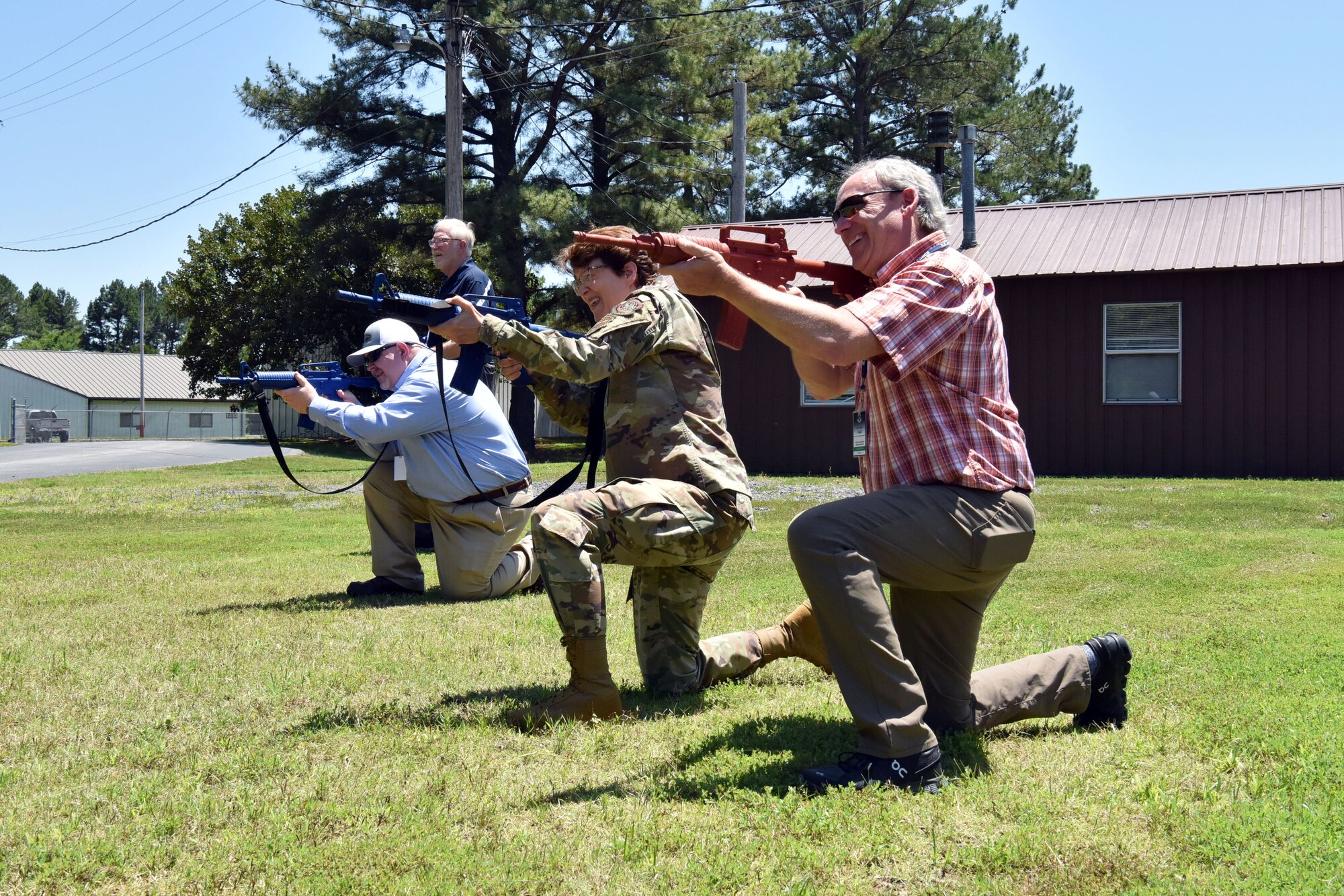 Gen. Jacqueline Van Ovost, Air Mobility Command commander, center, participates in small unit tactics training with AMC Civic Leaders