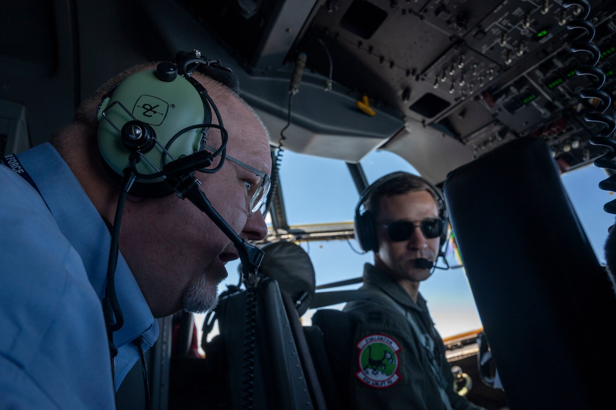 Troy Hogue, Air Mobility Command Civic Leader representing Little Rock Air Force Base, Arkansas, speaks with C-130J Super Hercules pilots during a flight to Vance AFB, Oklahoma
