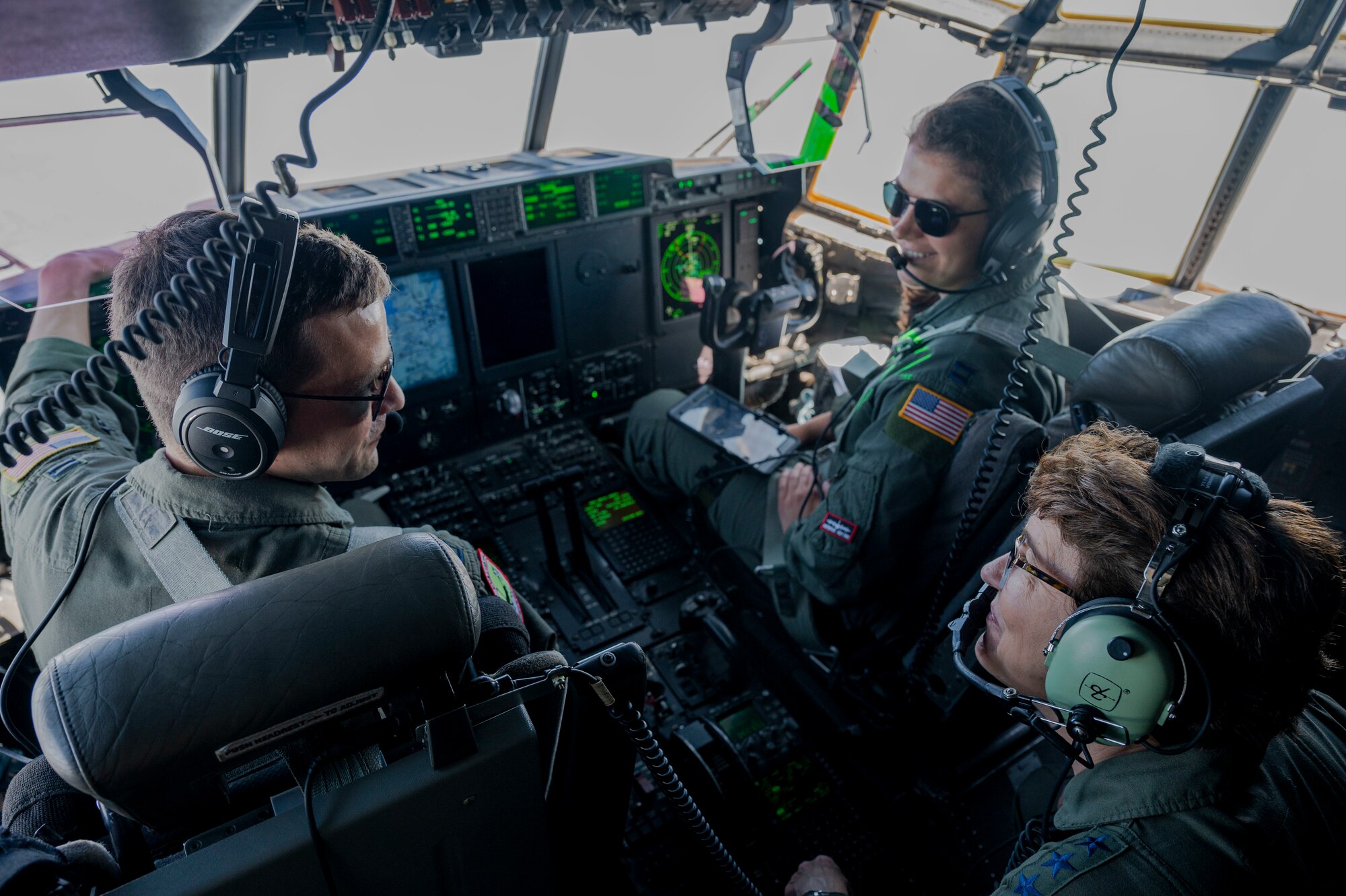 Gen. Jacqueline Van Ovost, Air Mobility Command commander, speaks with C-130J Super Hercules pilots during a flight to Vance AFB, Oklahoma