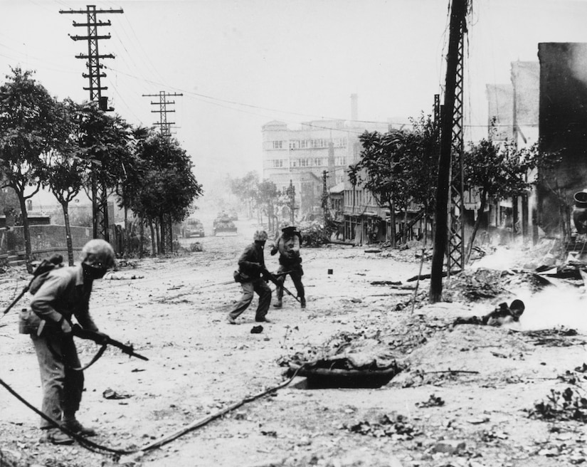 Marines engage in street fighting.