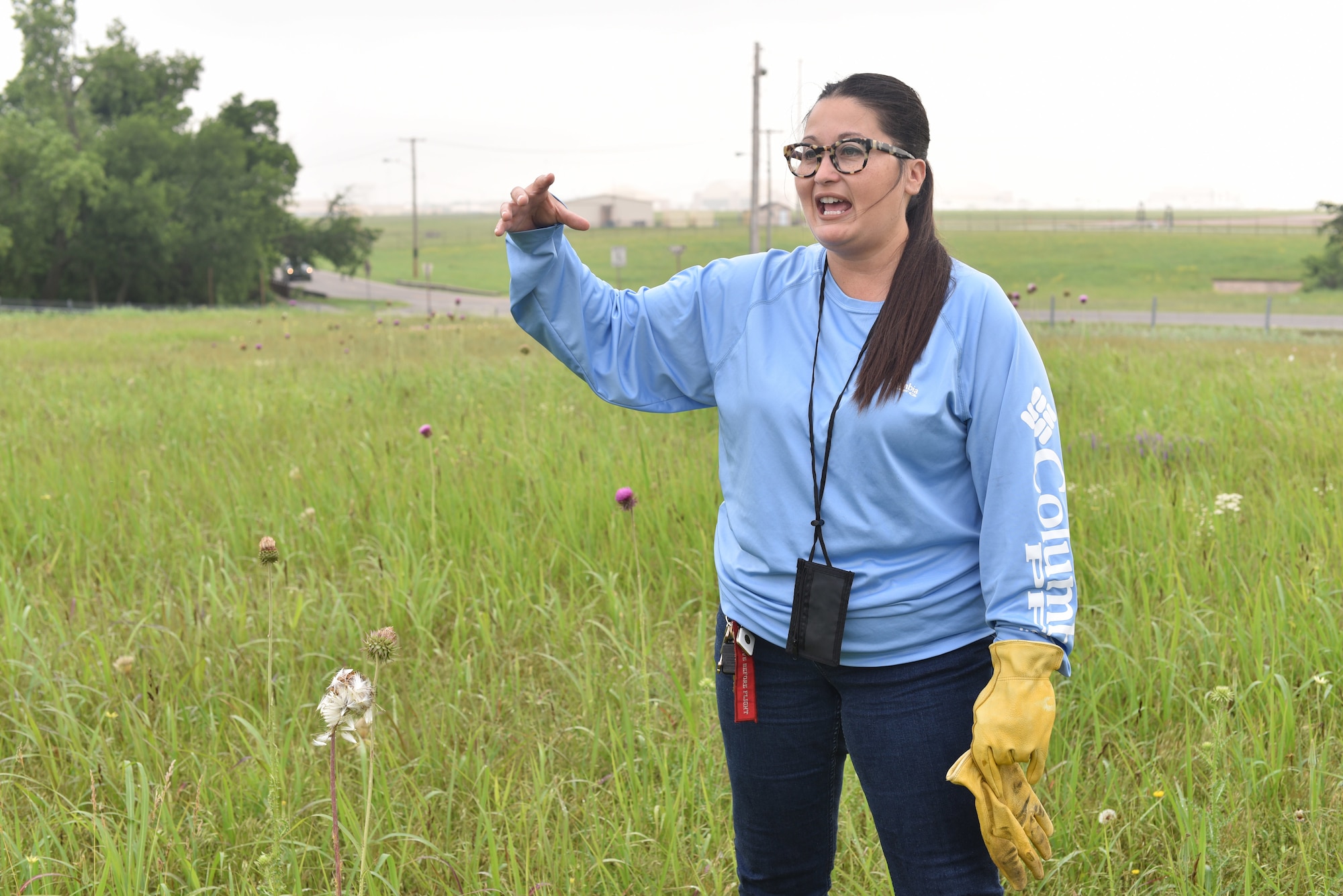 Woman talking in a field.