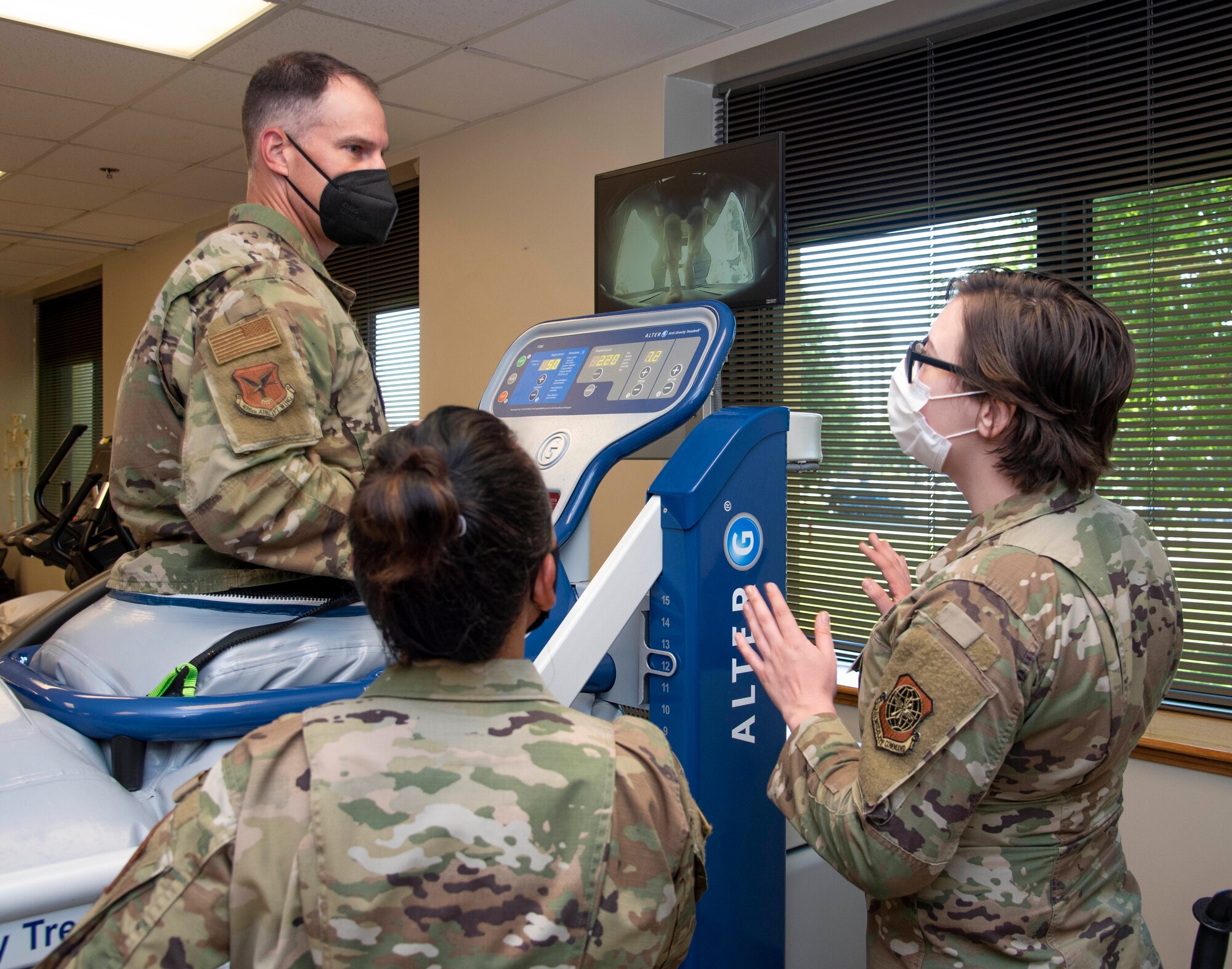 Airmen from the 436th Health Care Operations Squadron physical therapy flight, explain how the anti-gravity treadmill is used to rehabilitate patients to Col. Matt Husemann, 436th Airlift Wing commander, during a 436th Medical Group immersion at Dover Air Force Base, Delaware, June 17, 2021. The immersion gave Husemann hands-on experience of 436th MDG operations. (U.S. Air Force photo by Tech. Sgt. Nicole Leidholm)