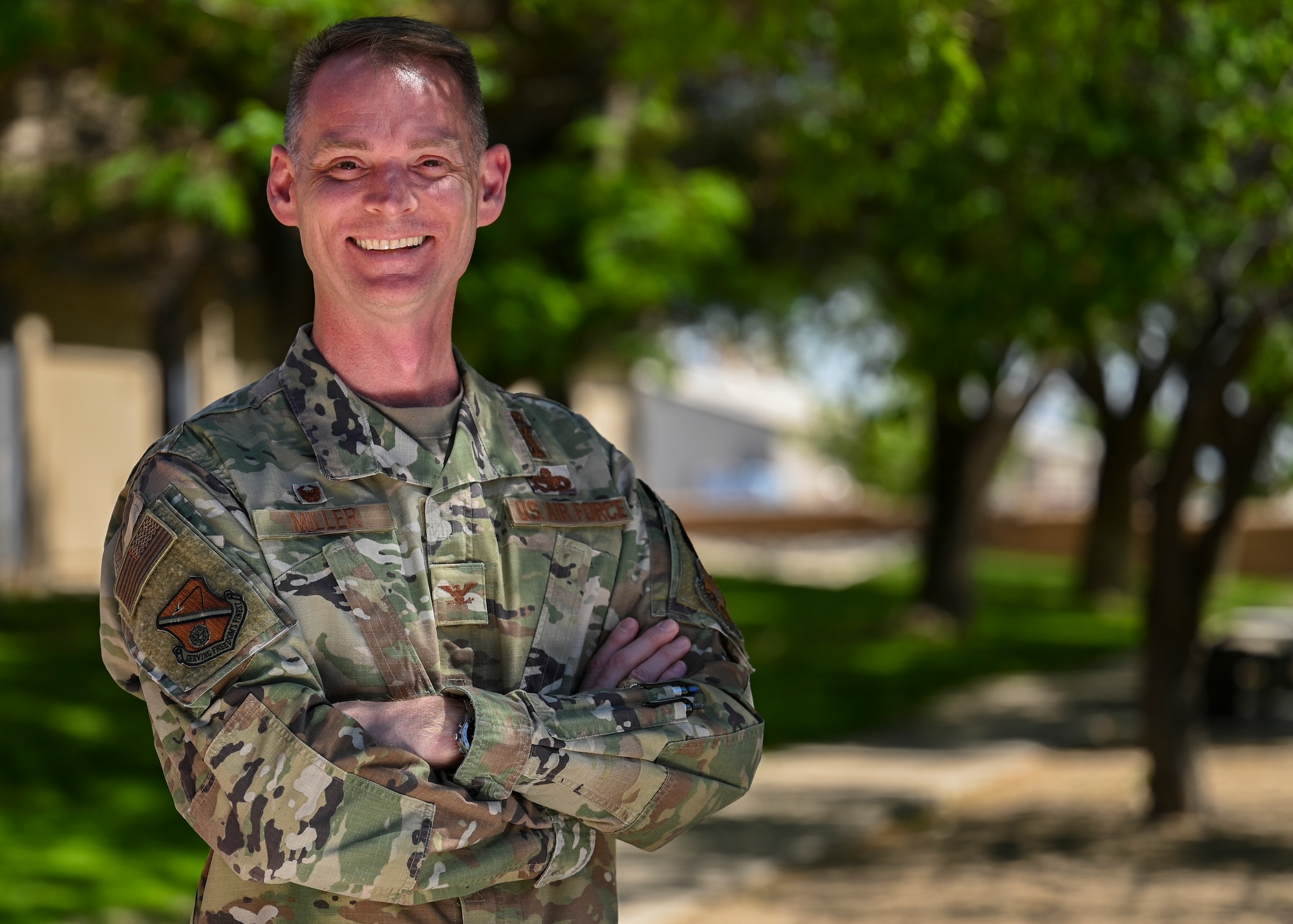 Air Force officer poses for outdoor photo.
