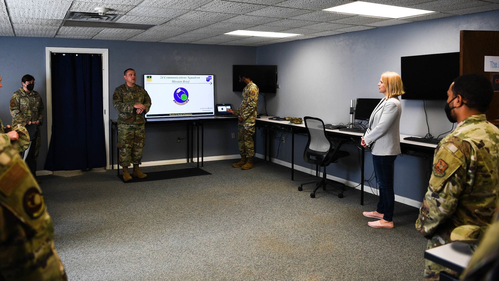 Lauren Barrett Knausenberger, right, Air Force chief information officer, receives a mission brief from the 2nd Communications Squadron during an official visit to Barksdale Air Force Base, Louisiana, June 16, 2021. During her visit, Knausenberger interacted with Airmen from across Air Force Global Strike Command and familiarized herself with their role in the mission. (U.S. Air Force photo by Senior Airman Jacob B. Wrightsman)