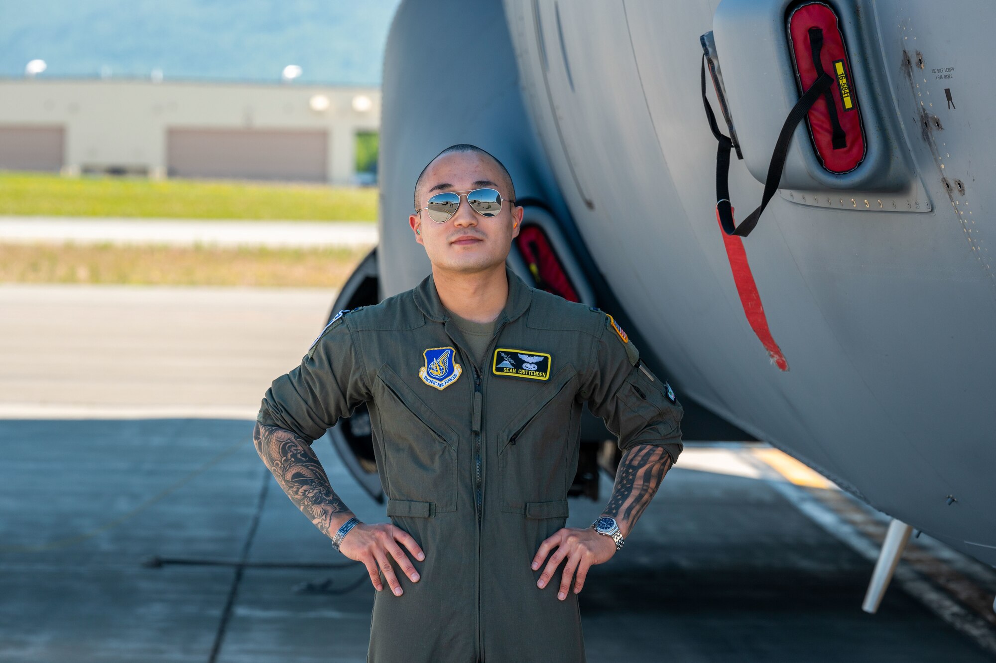 U.S. Air Force 1st Lt. Sean Crittenden, C-130J Super Hercules Pilot, assigned to the 36th Airlift Squadron at Yokota Air Force Base, Japan,  poses next to a C-130J Super Hercules on June 14, 2021, during RED FLAG-Alaska 21-2.