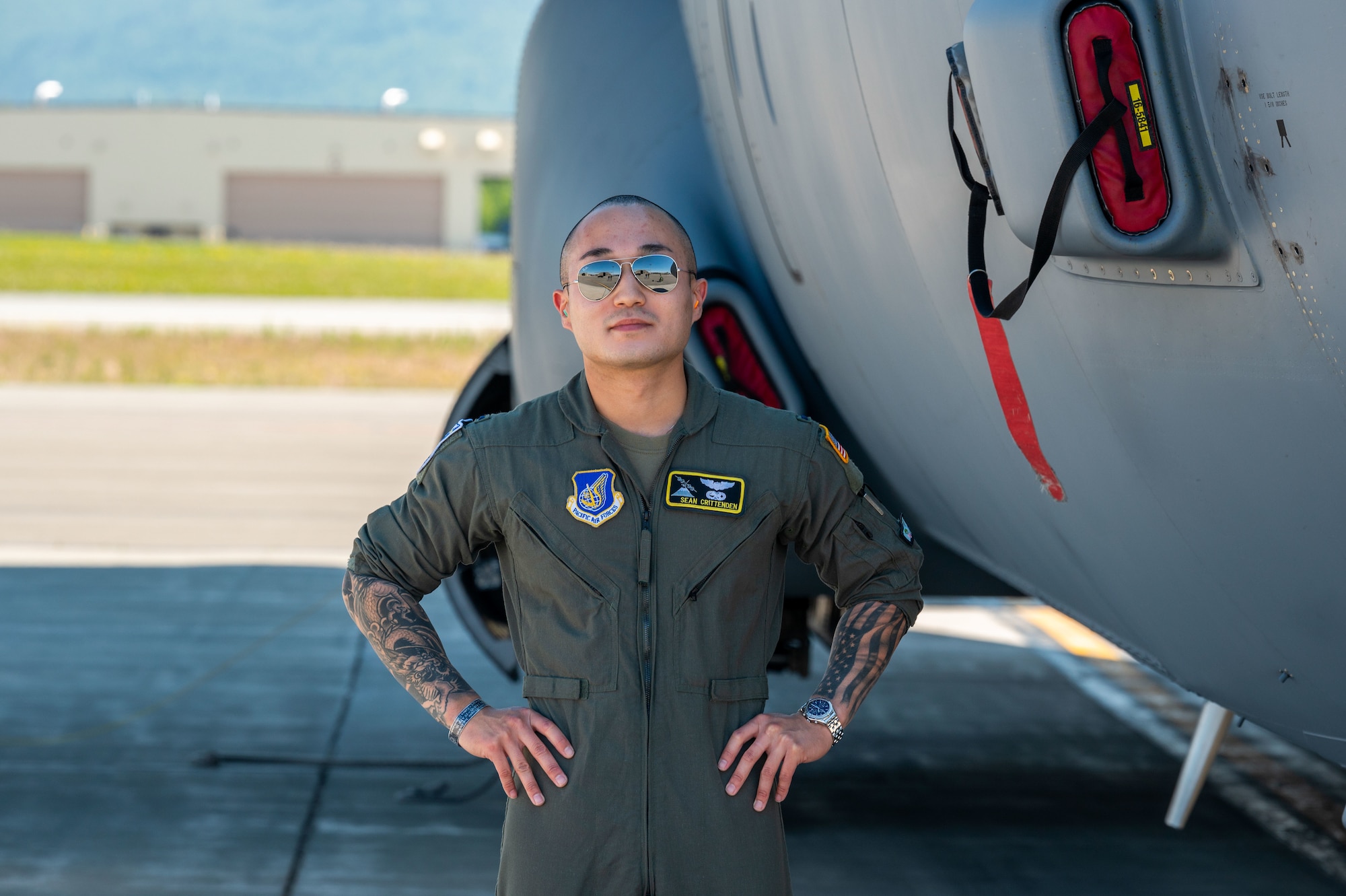 U.S. Air Force 1st Lt. Sean Crittenden, C-130J Super Hercules Pilot, assigned to the 36th Airlift Squadron at Yokota Air Force Base, Japan,  poses next to a C-130J Super Hercules on June 14, 2021, during RED FLAG-Alaska 21-2.