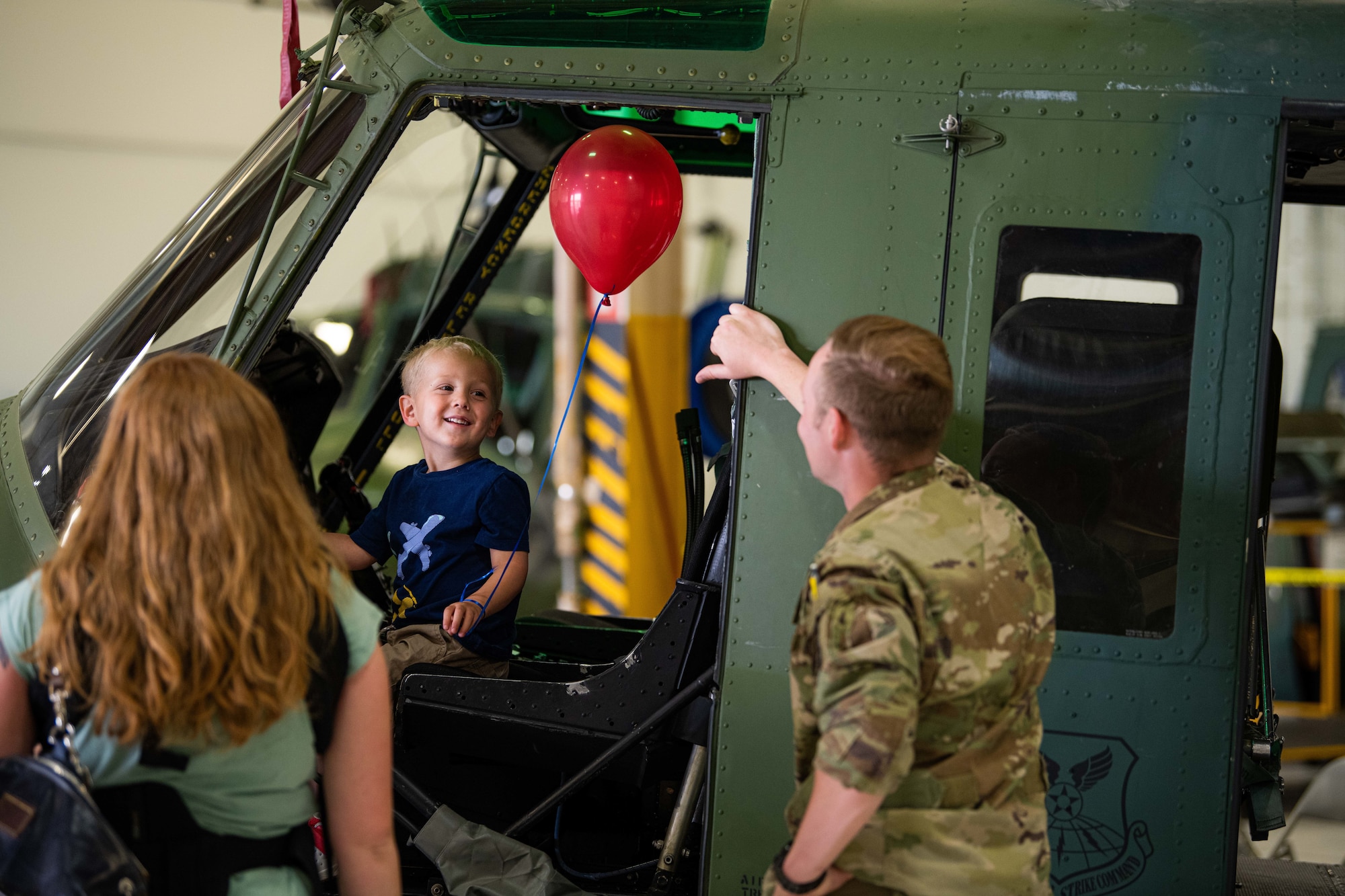 Wyatt, 3, mans the pilot seat of a UH-1N Huey at F. E. Warren Air Force Base, Wyoming, Friday, June 18, 2021. Dependents and family members were invited to visit various units and missions across the base for the 90th Missile Wing Family Weekend activities. (U.S. Air Force photo by Jordan Pickett)