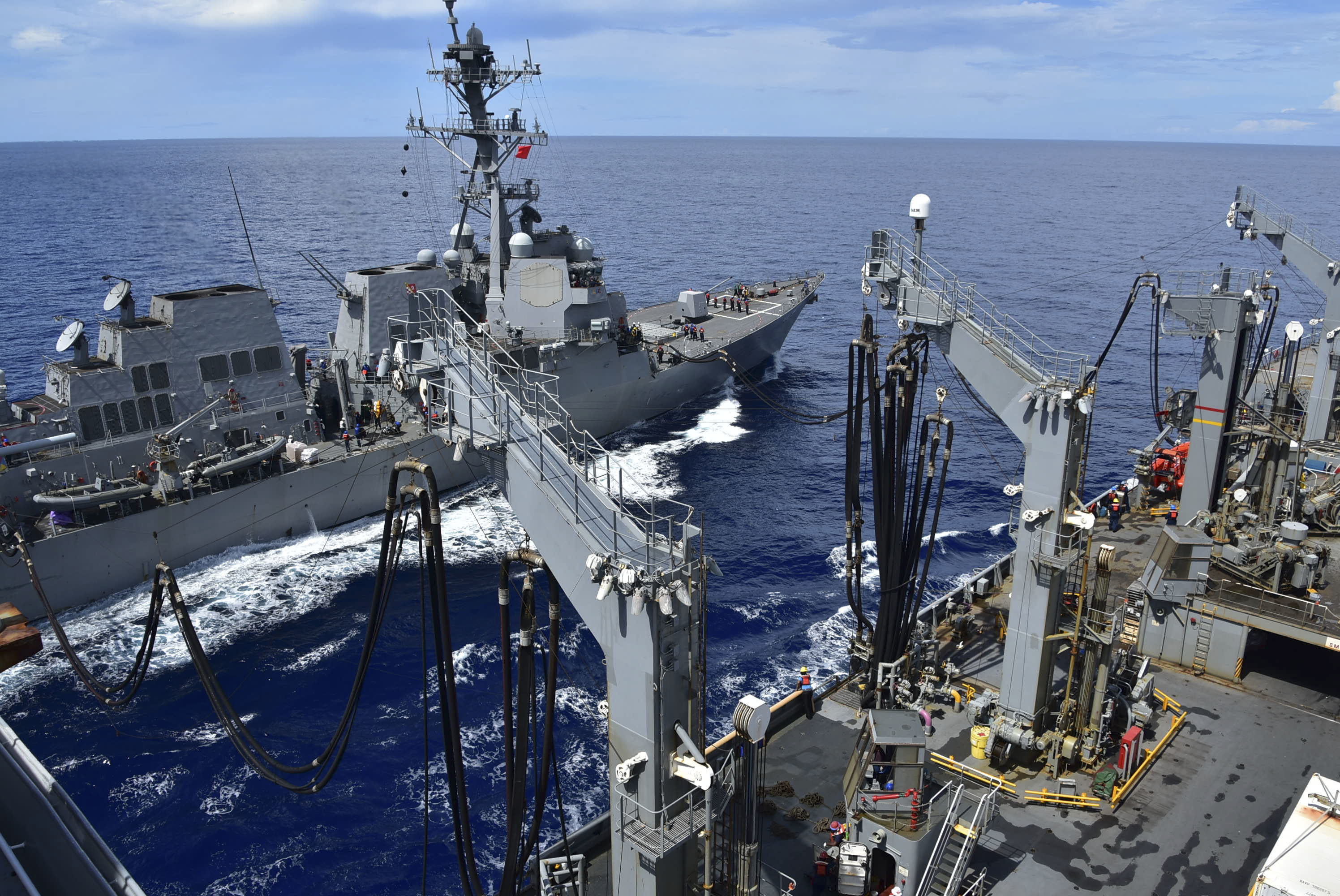 SOUTH CHINA SEA (July 15, 2020) – The Henry J. Kaiser-class fleet replenishment oiler USNS Tippecanoe (T-AO 199) transfers fuel to the Arleigh Burke-Class destroyer USS Ralph Johnson (DDG 114) during an underway replenishment. (U.S. Navy photo by Christopher Bosch)