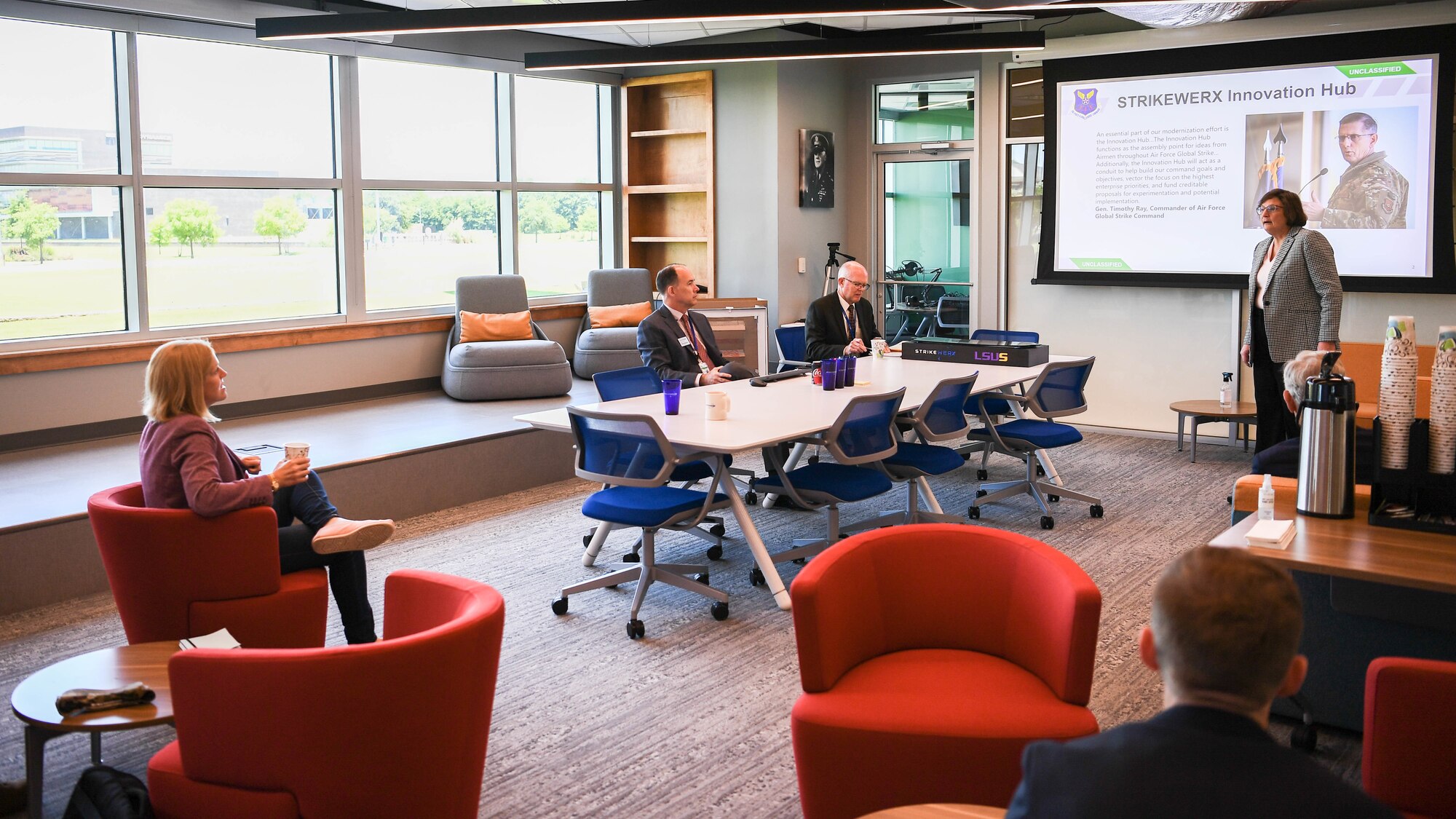 Lauren Barrett Knausenberger, sitting left, Air Force chief information officer, receives a brief by Dr. Donna Cowell Senft, right, Air Force Global Strike Command chief scientist, at the Cyber Innovation Center in Bossier City, Louisiana, June 15, 2021. The Cyber Innovation Center is the anchor of the 3,000 acre National Cyber Research Park and serves as the catalyst for the development and expansion of a knowledge-based workforce throughout the region. (U.S. Air Force photo by Senior Airman Jacob B. Wrightsman)