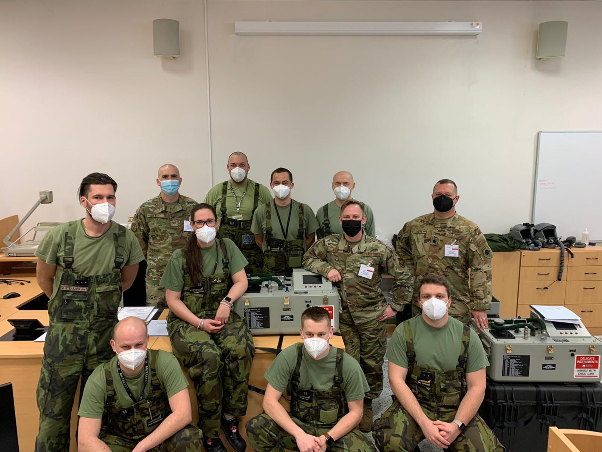 Airmen and Czechian Airmen pose for a photo.