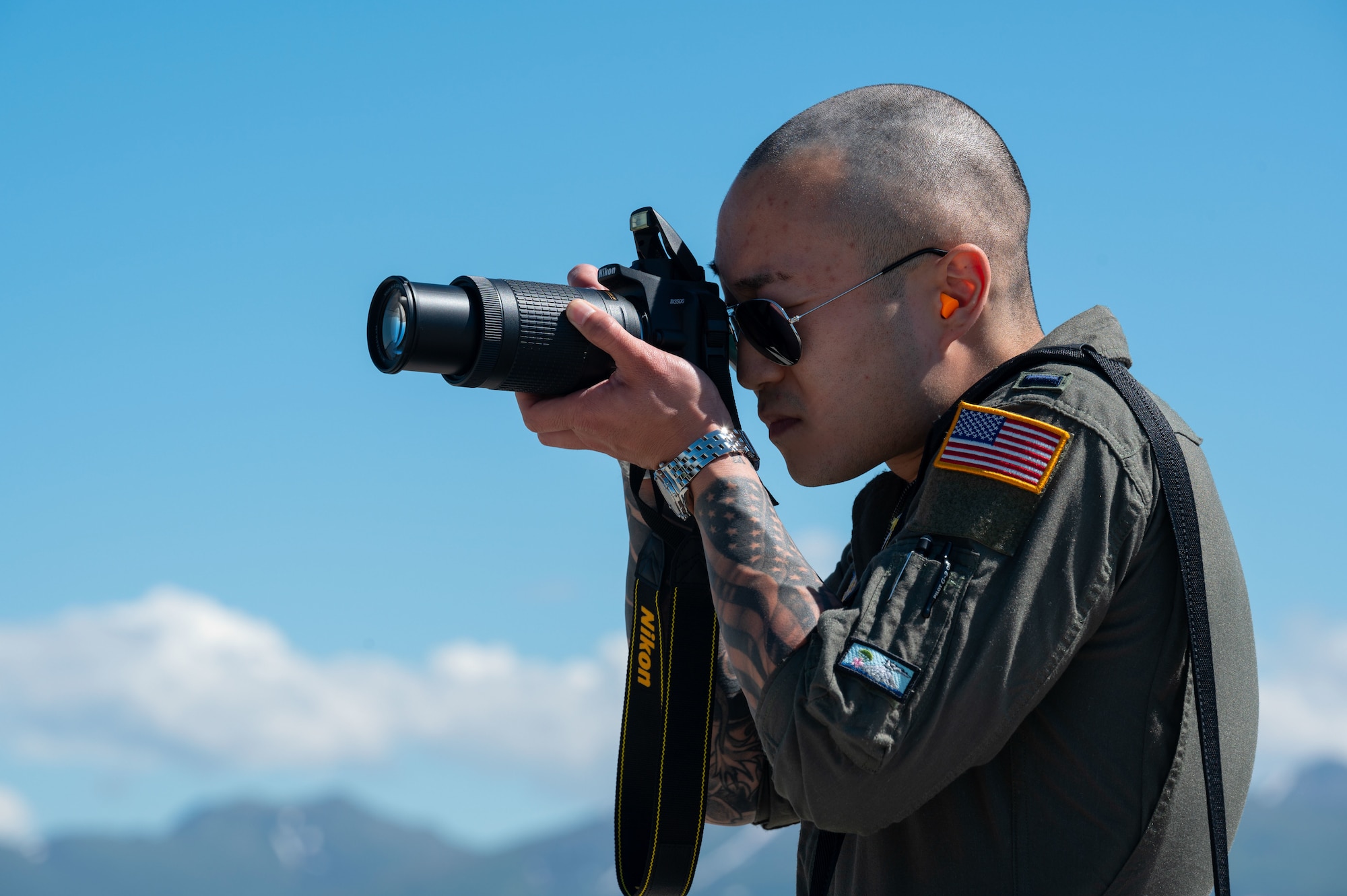 U.S. Air Force 1st Lt. Sean Crittenden, C-130J Super Hercules Pilot, assigned to the 36th Airlift Squadron at Yokota Air Force Base, Japan,  poses next to a C-130J Super Hercules on June 14, 2021, during RED FLAG-Alaska 21-2.