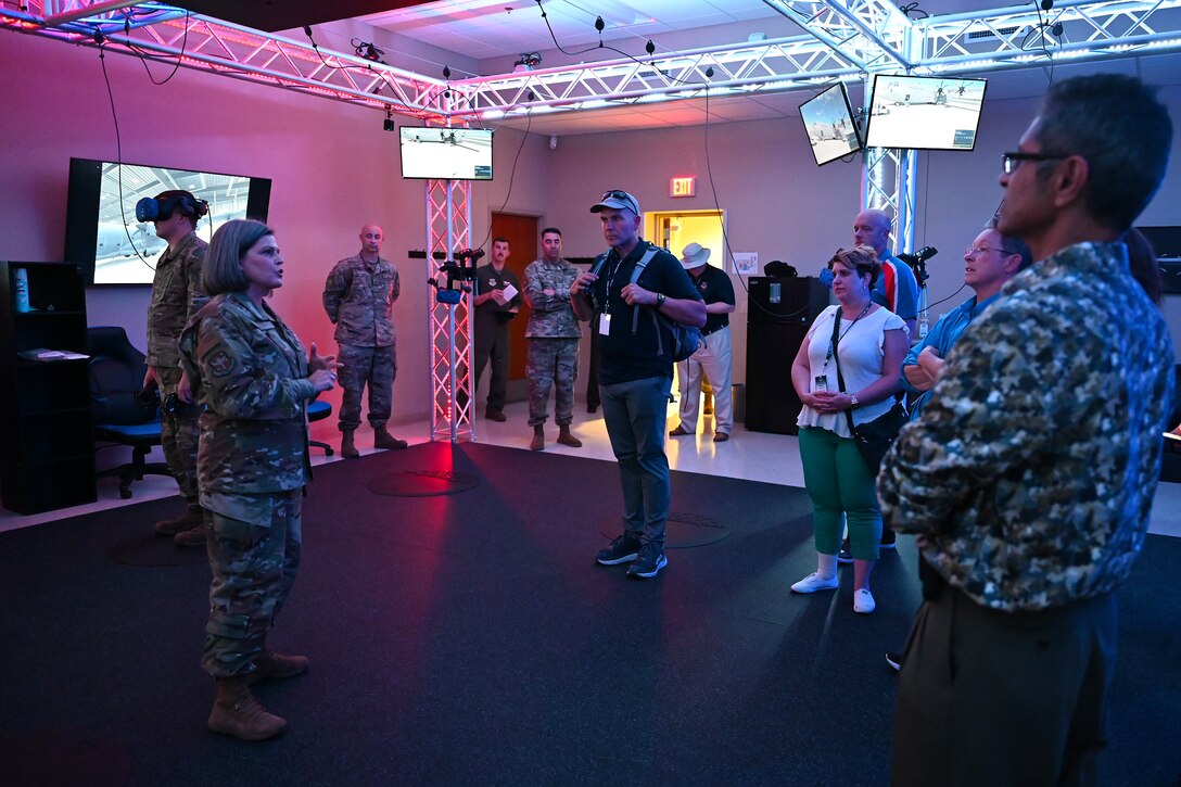 Lt. Col. Tiffany Feet, 19th Maintenance Group deputy commander, briefs Air Mobility Command Civic Leaders in the 19th MXG’s new virtual reality maintenance hangar