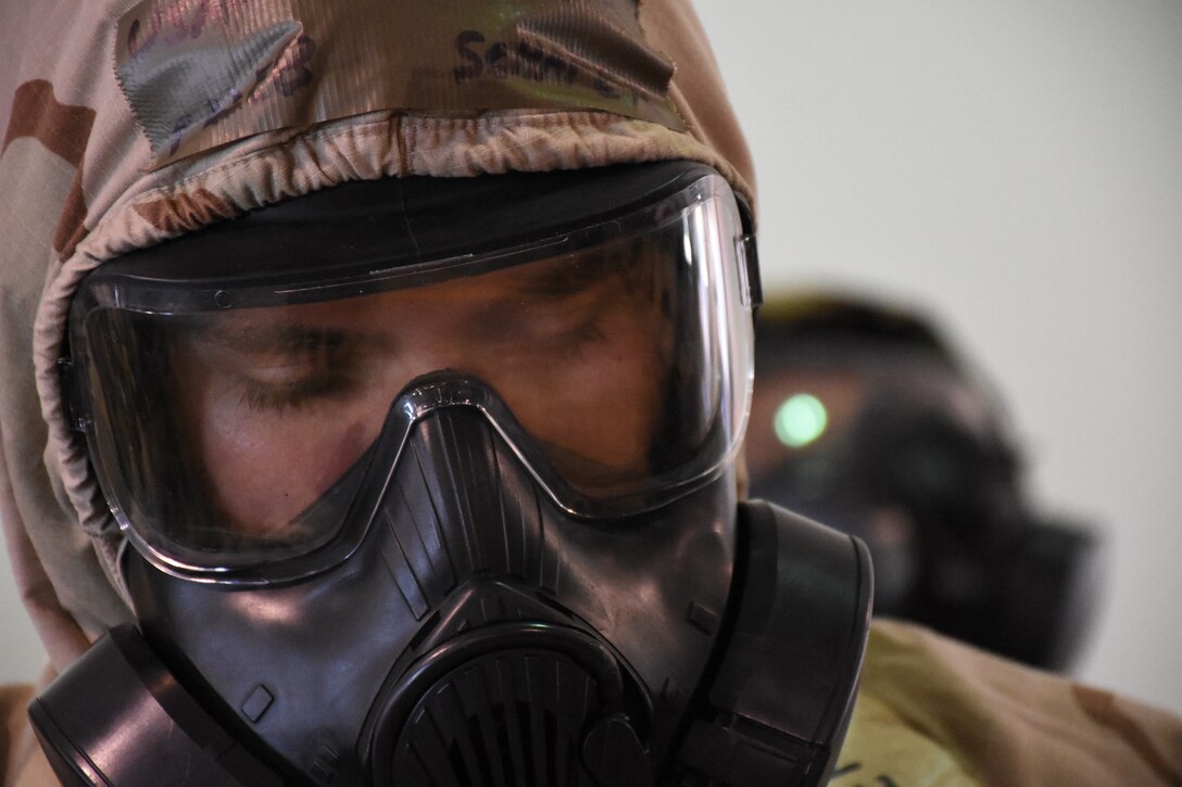 An Airman wears a gas mask.