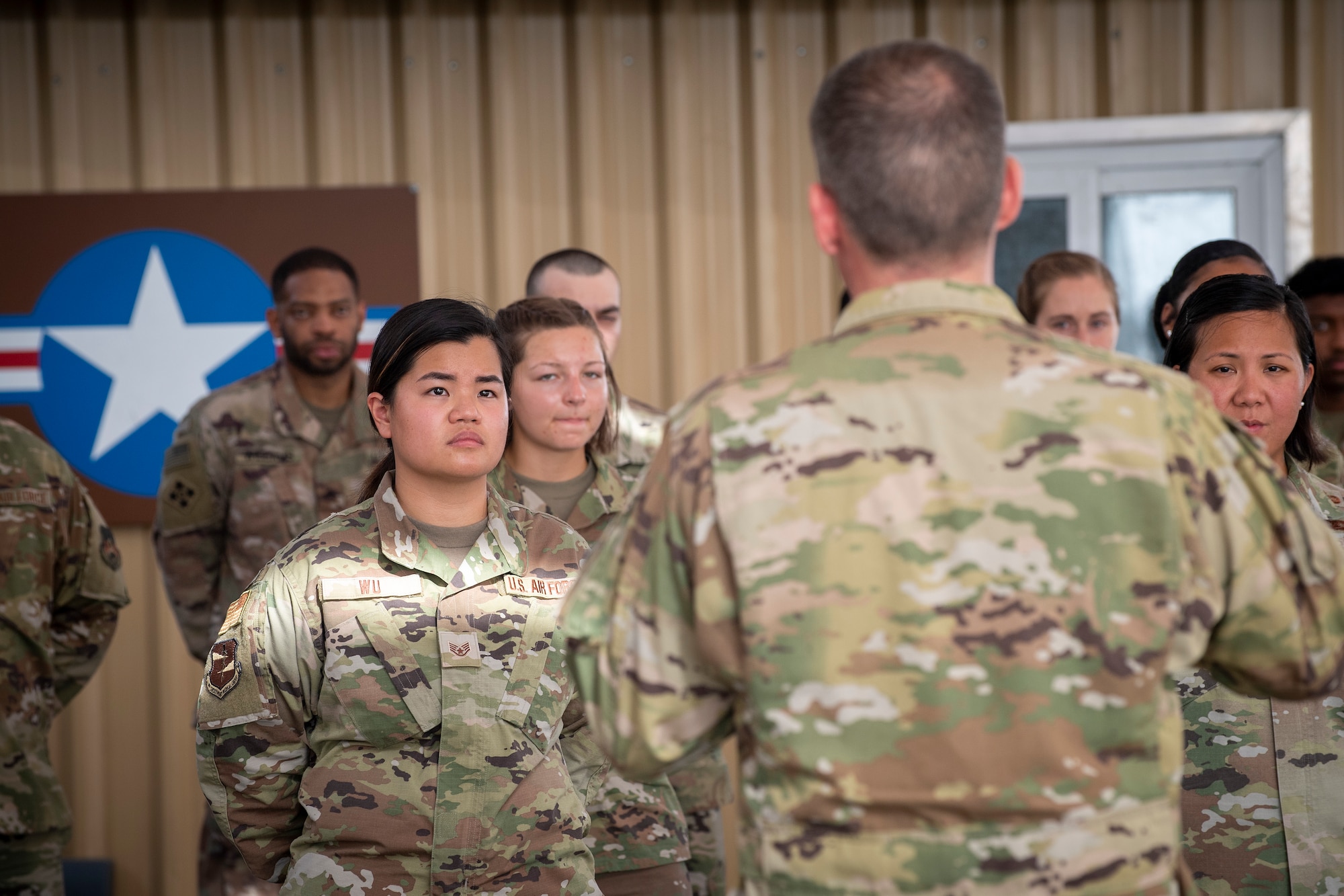 U.S. Air Force Brig. Gen. Andrew Clark, 380th Air Expeditionary Wing commander, administers an oath to the Teal Team 6 (TT6) volunteer members during the Sexual Assault Prevention and Response (SAPR), TT6 induction ceremony at Al Dhafra Air Base (ADAB) United Arab Emirates, June 18, 2021. TT6 members, take an oath to uphold a code of ethics, promote mutual respect, to support others and promise to improve the culture around them.