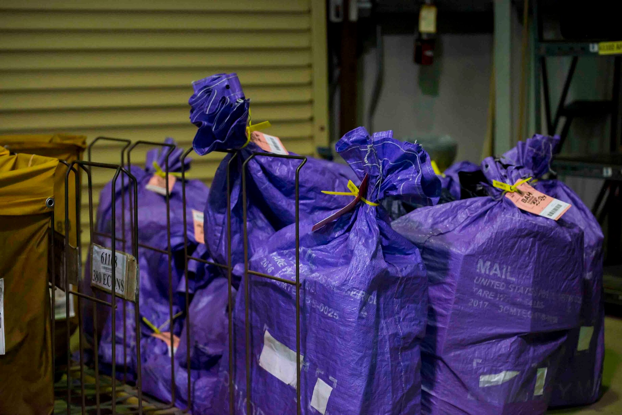 U.S. Air Force Airmen from the 380th Expeditionary Force Support Squadron, sort mail packages at Al Dhafra Air Base (ADAB), United Arab Emirates, June 16, 2021. The ADAB post office averages 52,000 lbs across 8,500 packages a month.