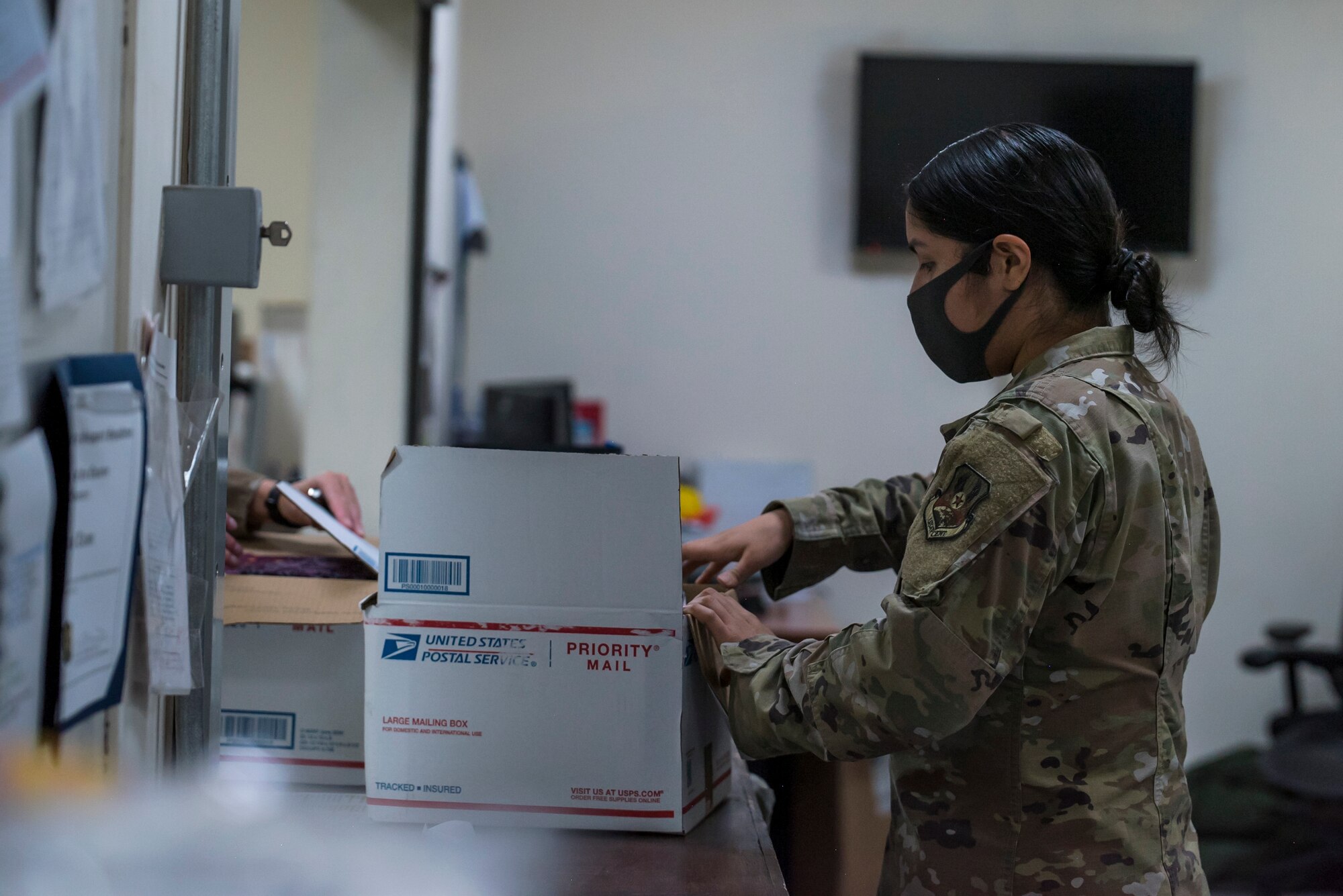 U.S. Air Force Airmen from the 380th Expeditionary Force Support Squadron, sort mail packages at Al Dhafra Air Base (ADAB), United Arab Emirates, June 16, 2021. The ADAB post office averages 52,000 lbs across 8,500 packages a month.