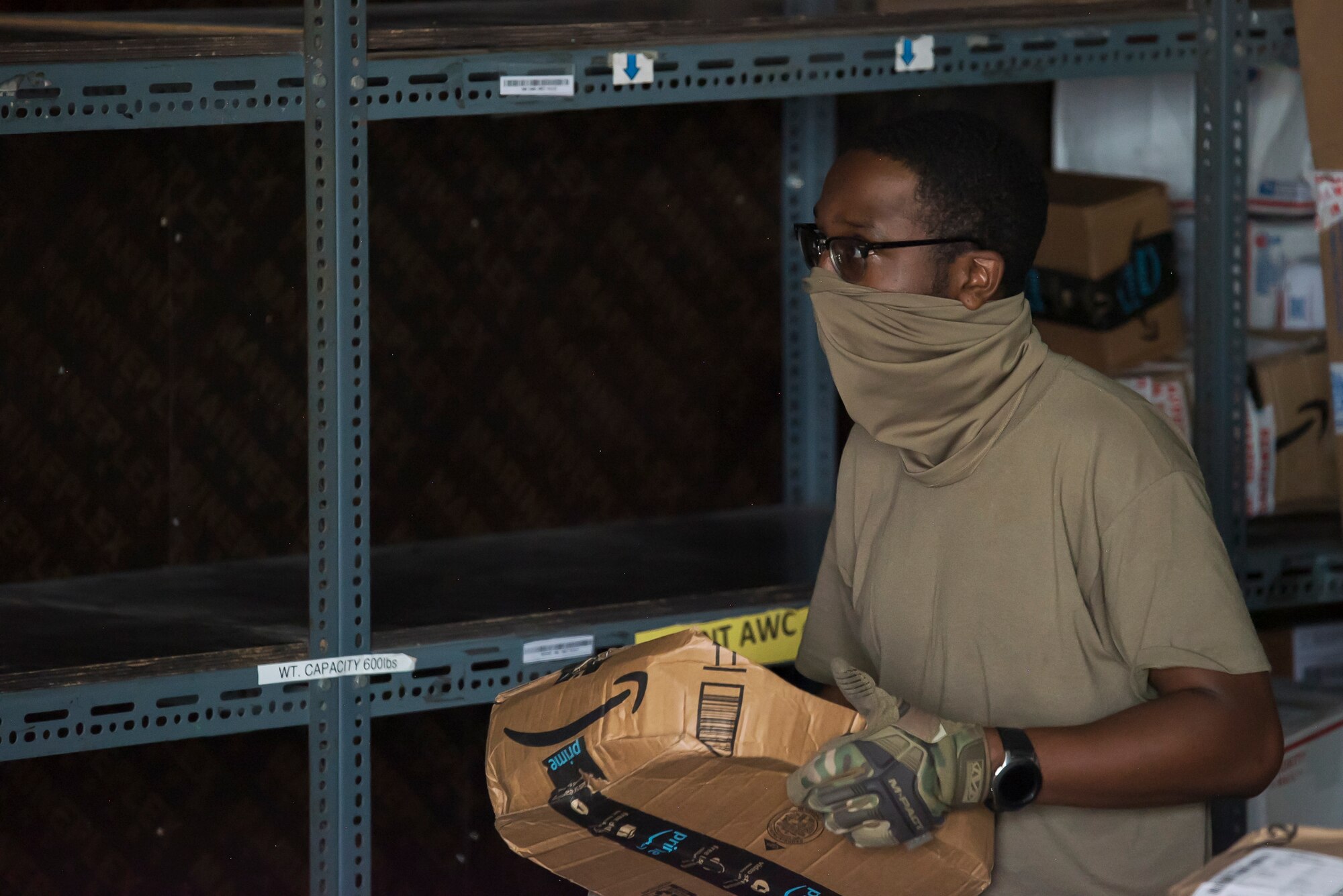 U.S. Air Force Airmen from the 380th Expeditionary Force Support Squadron, sort mail packages at Al Dhafra Air Base (ADAB), United Arab Emirates, June 16, 2021. The ADAB post office averages 52,000 lbs across 8,500 packages a month.