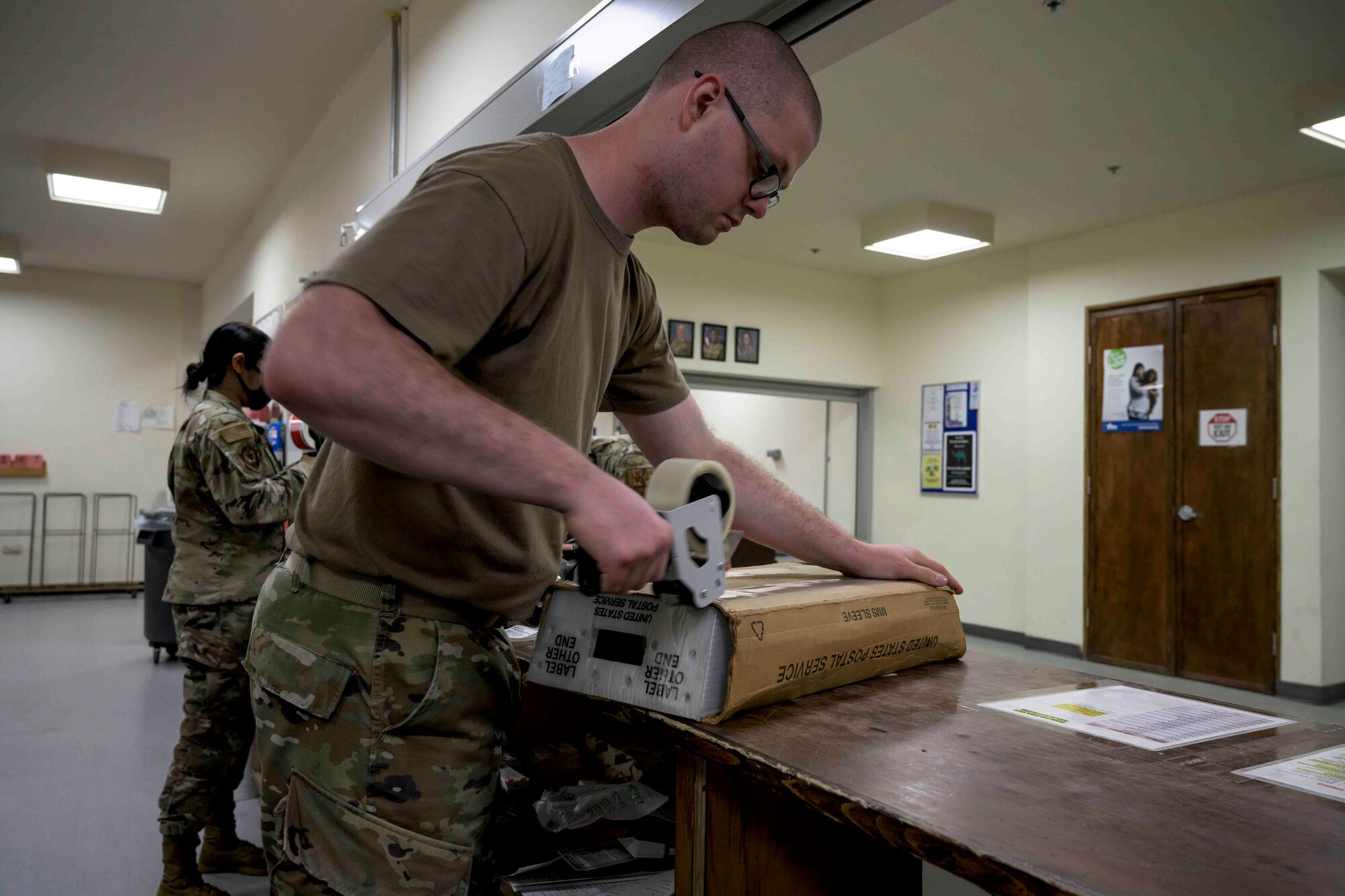 U.S. Air Force Airmen from the 380th Expeditionary Force Support Squadron, sort mail packages at Al Dhafra Air Base (ADAB), United Arab Emirates, June 16, 2021. The ADAB post office averages 52,000 lbs across 8,500 packages a month.