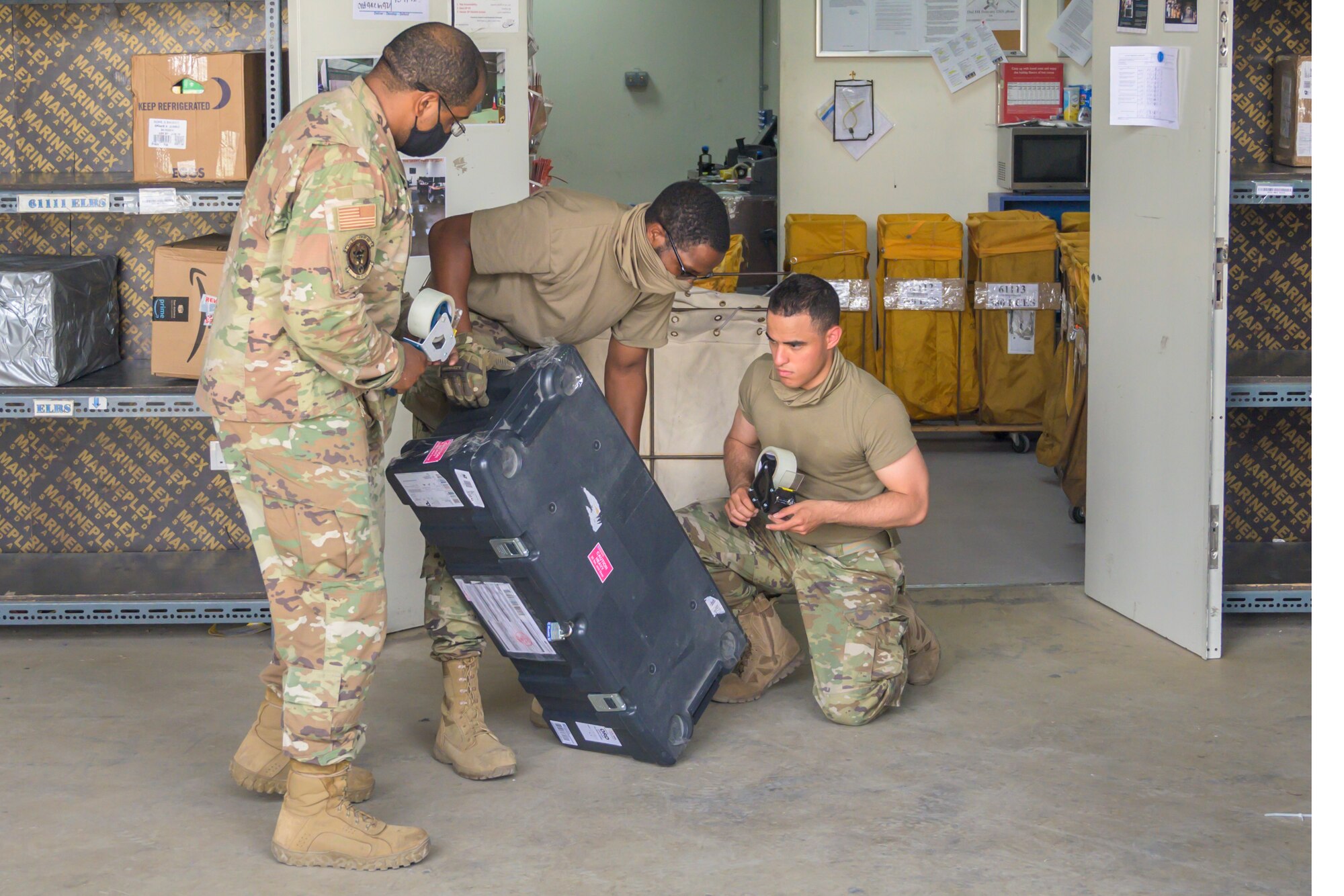 U.S. Air Force Airmen from the 380th Expeditionary Force Support Squadron, sort mail packages at Al Dhafra Air Base (ADAB), United Arab Emirates, June 16, 2021. The ADAB post office averages 52,000 lbs across 8,500 packages a month.