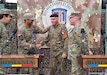 U.S. Army Reserve Maj. Allen Rust, an air and missile defense chief with the 209th Digital Liaison Detachment, 7th Mission Support Command, left, shakes hands with Romanian Army Col. Adrian Petrica of the Multi-National Command Southeast, at the close of a DEFENDER-Europe 21 command post exercise in Bucharest, Romania, June 14, 2021. The 209th DLD provided liaison capability between the U.S. Army´s V Corps, Joint Force Land Component Command and the Romanian MNC-SE.