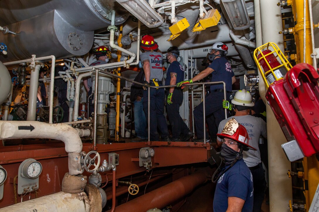 Members of the 29th Annual Robert E. Rumens Marine Firefighting School tour and receive training at Norfolk Naval Shipyard (NNSY) during an outreach event. The training allowed NNSY a chance to share its expertise in industrial shipboard firefighting with future members of the Port of Virginia’s Maritime Incident Response Team (MIRT).