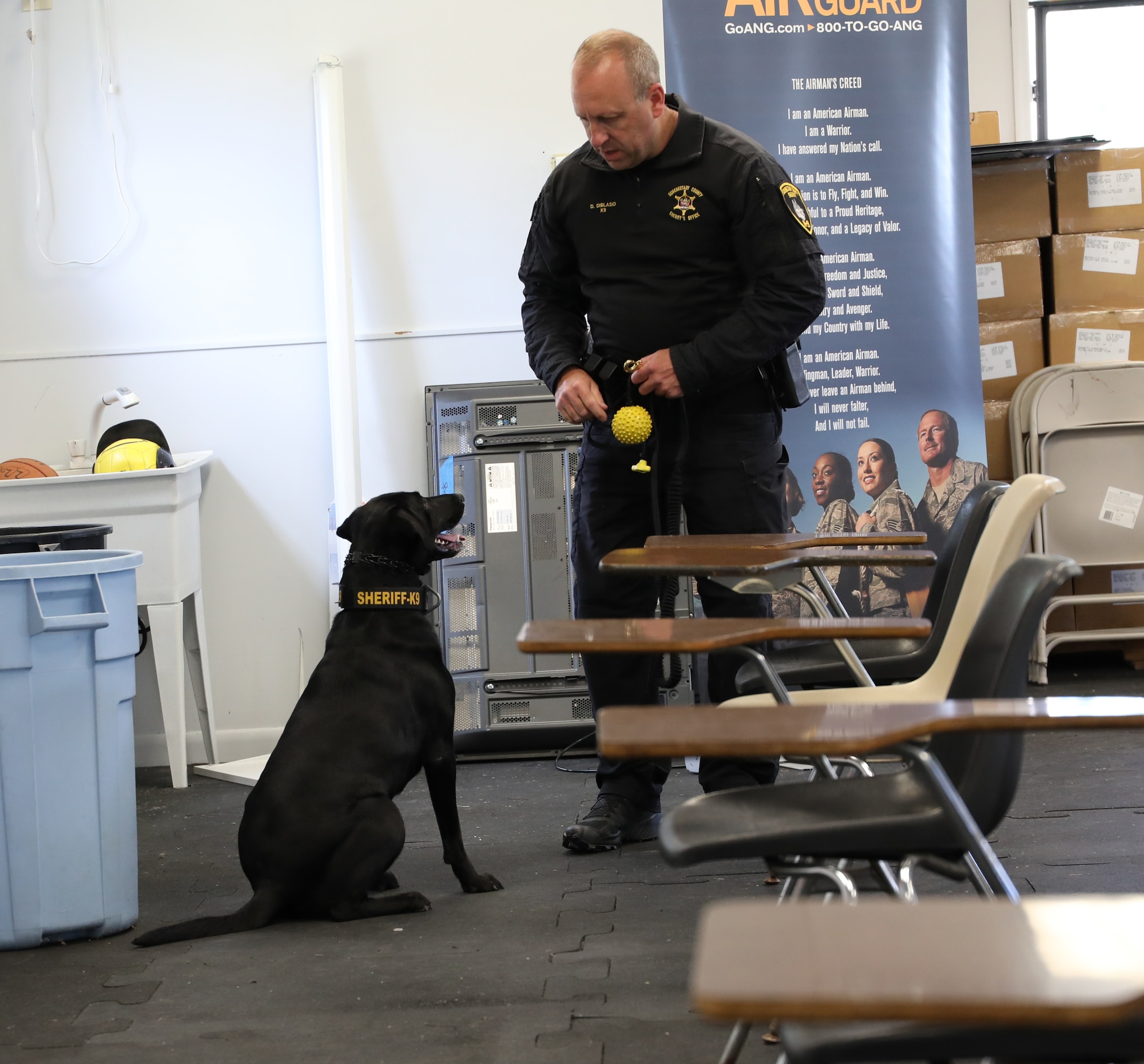K9 Maizey works with her handler Dan Diblasio, a police officer with the Schenectady County Sheriff Office. The Officers and K9s recently trained at Stratton ANGB where they also provide support to the Security Forces Squadron when needed. (U.S. Air National Guard photo by Ms. Jaclyn Lyons)