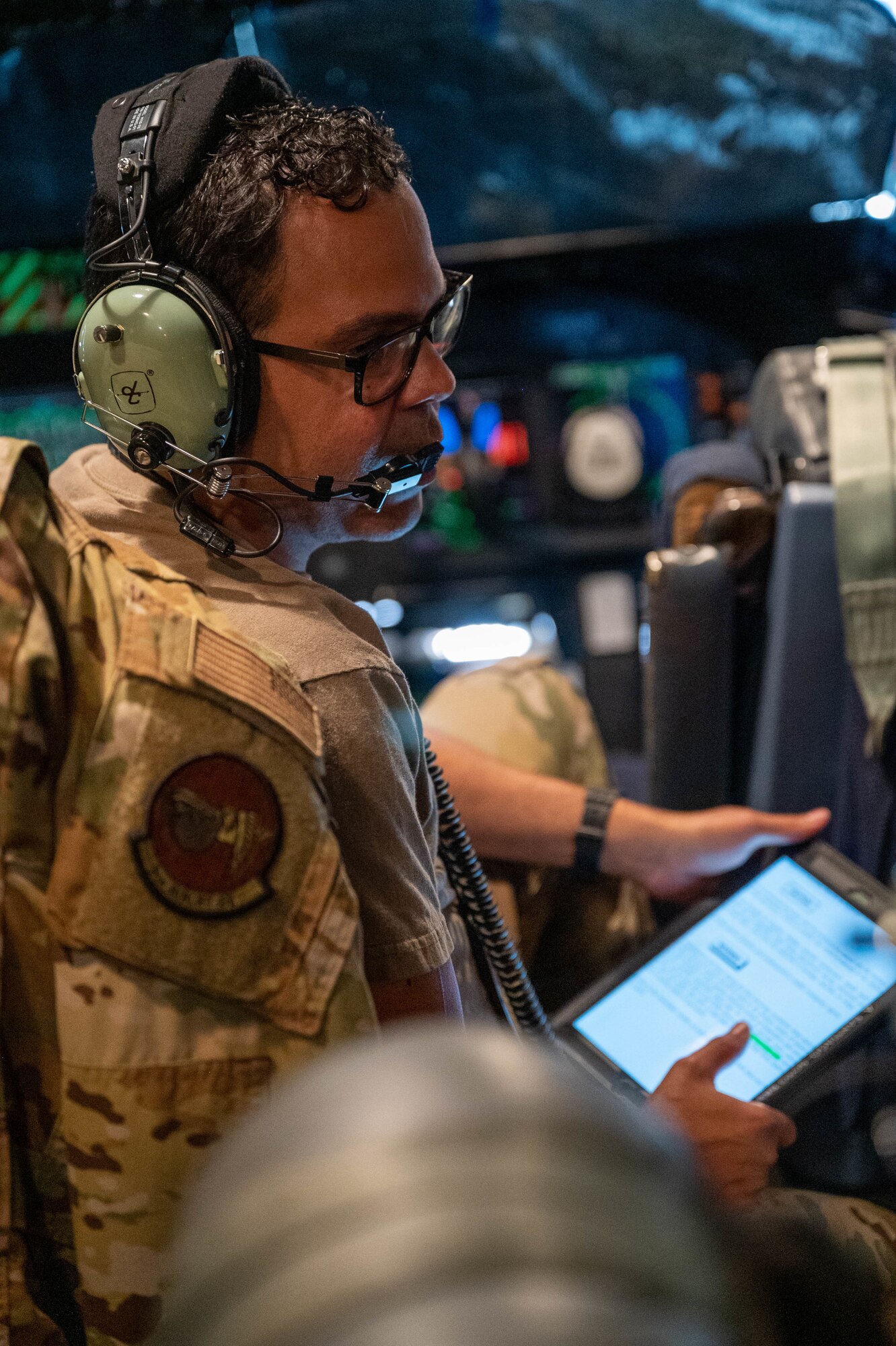 Tech. Sgt. Abimael Santiago-Soto, 9th Airlift Squadron noncommissioned officer in charge of training, explains checklists while instructing flight engineer students aboard a Dover Air Force Base C-5M Super Galaxy during a Major Command Service Tail Trainer at Holloman AFB, New Mexico, June 2, 2021. The 9th AS performs MSTTs to expedite upgrade and qualification training for C-5M loadmasters and flight engineers. (U.S. Air Force photo by Senior Airman Faith Schaefer)