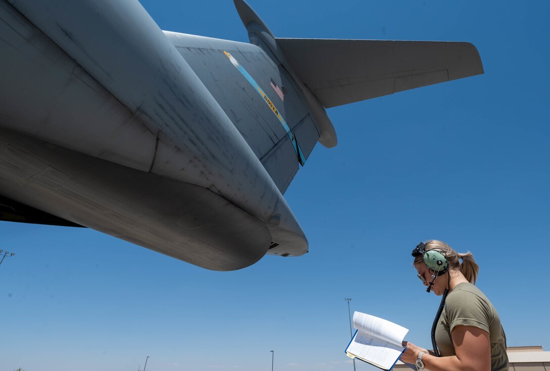 Airman 1st Class Rebecca Reimer, 9th Airlift Squadron loadmaster student, checks a pre-loading checklist for a Dover Air Force Base C-5M Super Galaxy during a Major Command Service Tail Trainer at Holloman AFB, New Mexico, June 7, 2021. The 9th AS performs MSTTs to expedite upgrade and qualification training for C-5M loadmasters and flight engineers. Of the 350 tasks needed to be a fully qualified loadmaster, roughly half can be completed during an MSTT. (U.S. Air Force photo by Senior Airman Faith Schaefer)