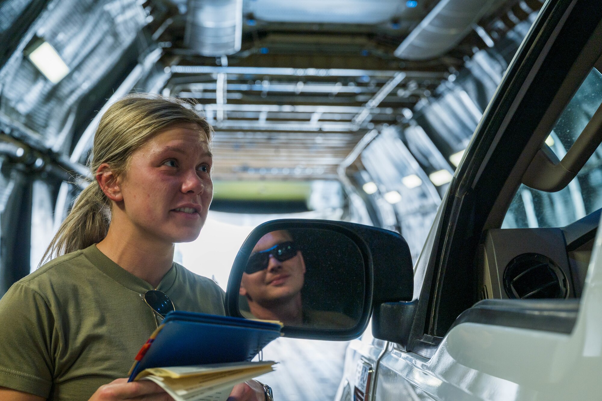Airman 1st Class Rebecca Reimer, 9th Airlift Squadron loadmaster student, discusses offloading procedures with Staff Sgt. Jordan Chandanais, 49th Logistics Readiness Squadron Air Transportation Function supervisor, while aboard a Dover Air Force Base C-5M Super Galaxy during a Major Command Service Tail Trainer at Holloman AFB, New Mexico, June 7, 2021. Following an initiative from Air Mobility Command, MSTTs have been in the training plan of the 9th AS since early 2021 to expedite upgrade and qualification training for C-5M Super Galaxy loadmasters and flight engineers. This MSTT was coordinated in partnership with Air Education Training Command’s 49th Wing and Air Force Materiel Command’s 635th Materiel Maintenance Group. (U.S. Air Force photo by Senior Airman Faith Schaefer)