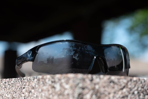 Sunglasses on a wall.