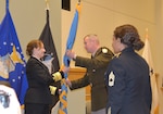 DLA Director Navy Vice Adm. Michelle Skubic (left) passes the DLA Troop Support command flag to Army Brig. Gen. Eric Shirley during an Assumption of Command ceremony June 17 in Philadelphia.