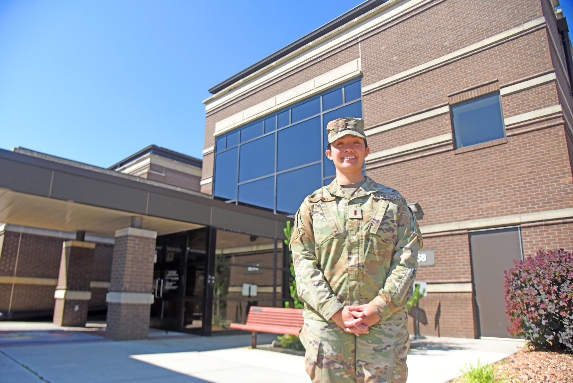 2nd Lt. Brittney Sturgis pose for a picture outside the 87th MDG facility.