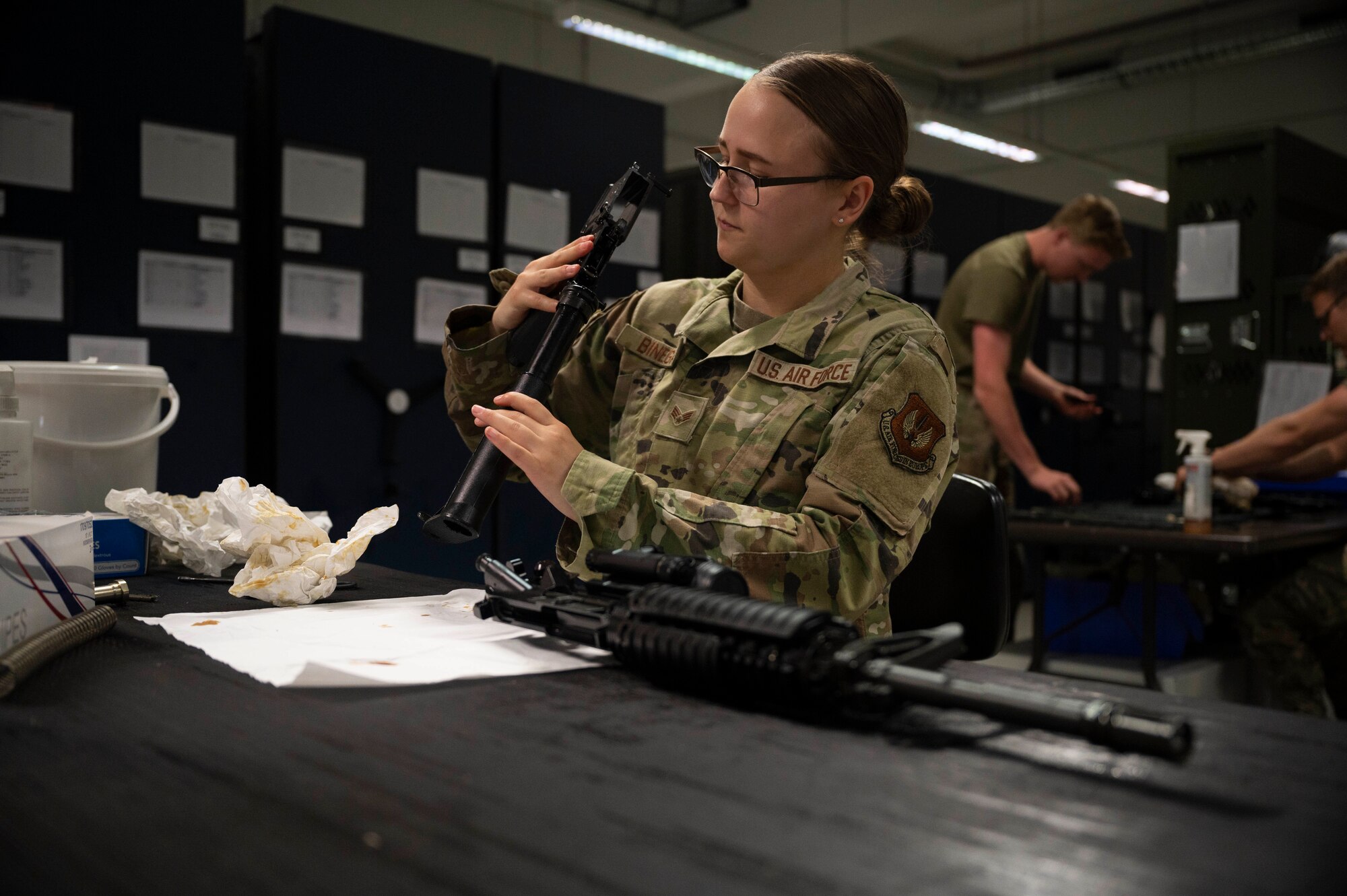 U.S. Air Force Senior Airman Kaitlyn Binegar, 86th Logistics Readiness Squadron materiel management journeyman cleans an M-4 carbine