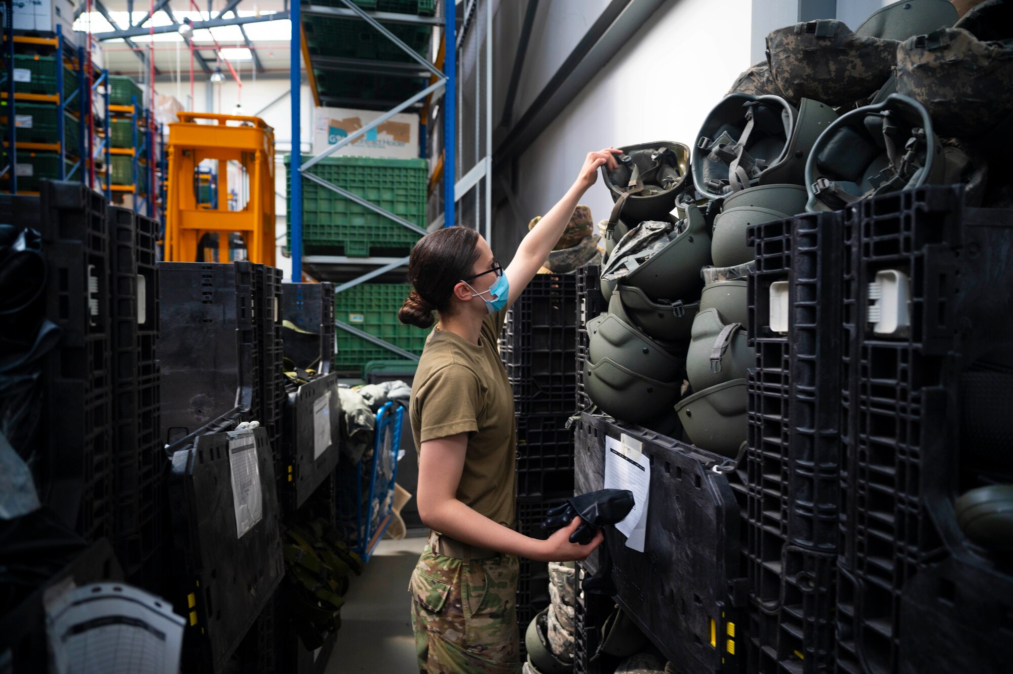 U.S. Air Force Airman 1st Class Christy Riddell, 86th Logistics Readiness Squadron individual protective equipment journeyman, takes inventory of protective equipment