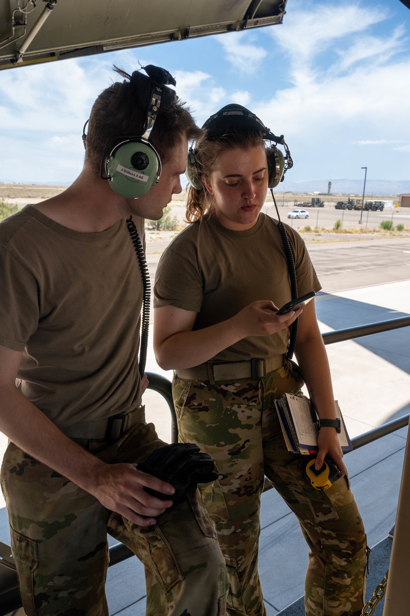 Staff Sgt. John Dittess, left, and Senior Airman Amelia Bradfield, both 9th Airlift Squadron loadmasters, calculate the weight of palletized cargo before loading it onto a Dover Air Force Base C-5M Super Galaxy during a Major Command Service Tail Trainer exercise at Holloman AFB, New Mexico, June 2, 2021.The 9th AS performs MSTTs to expedite upgrade and qualification training for C-5M loadmasters and flight engineers. Over the course of the 10-day MSTT, 9th AS loadmasters loaded and unloaded 320,085 pounds of cargo, including palletized cargo, aircraft ground equipment, a fuel truck and a K-loader. (U.S. Air Force photo by Senior Airman Faith Schaefer)