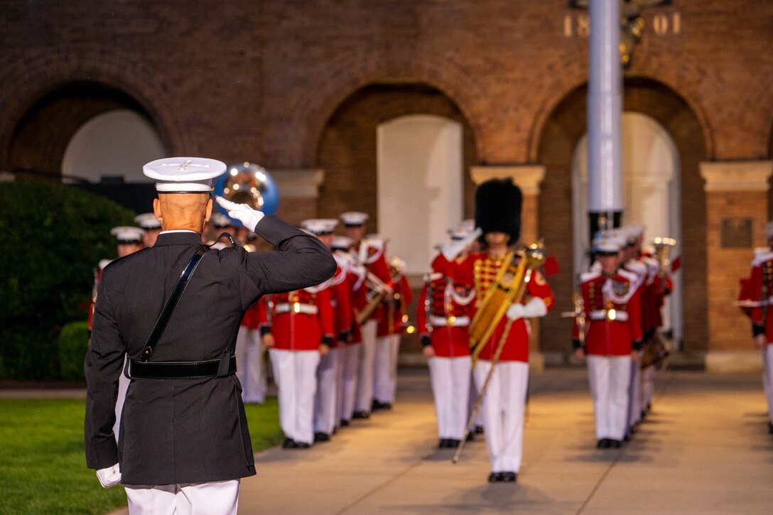 Lieutenant Col. Darrel L. Choat, executive officer, Marine Barracks Washington, renders a salute during a Friday Evening Parade at Marine Barracks Washington, June 18, 2021.