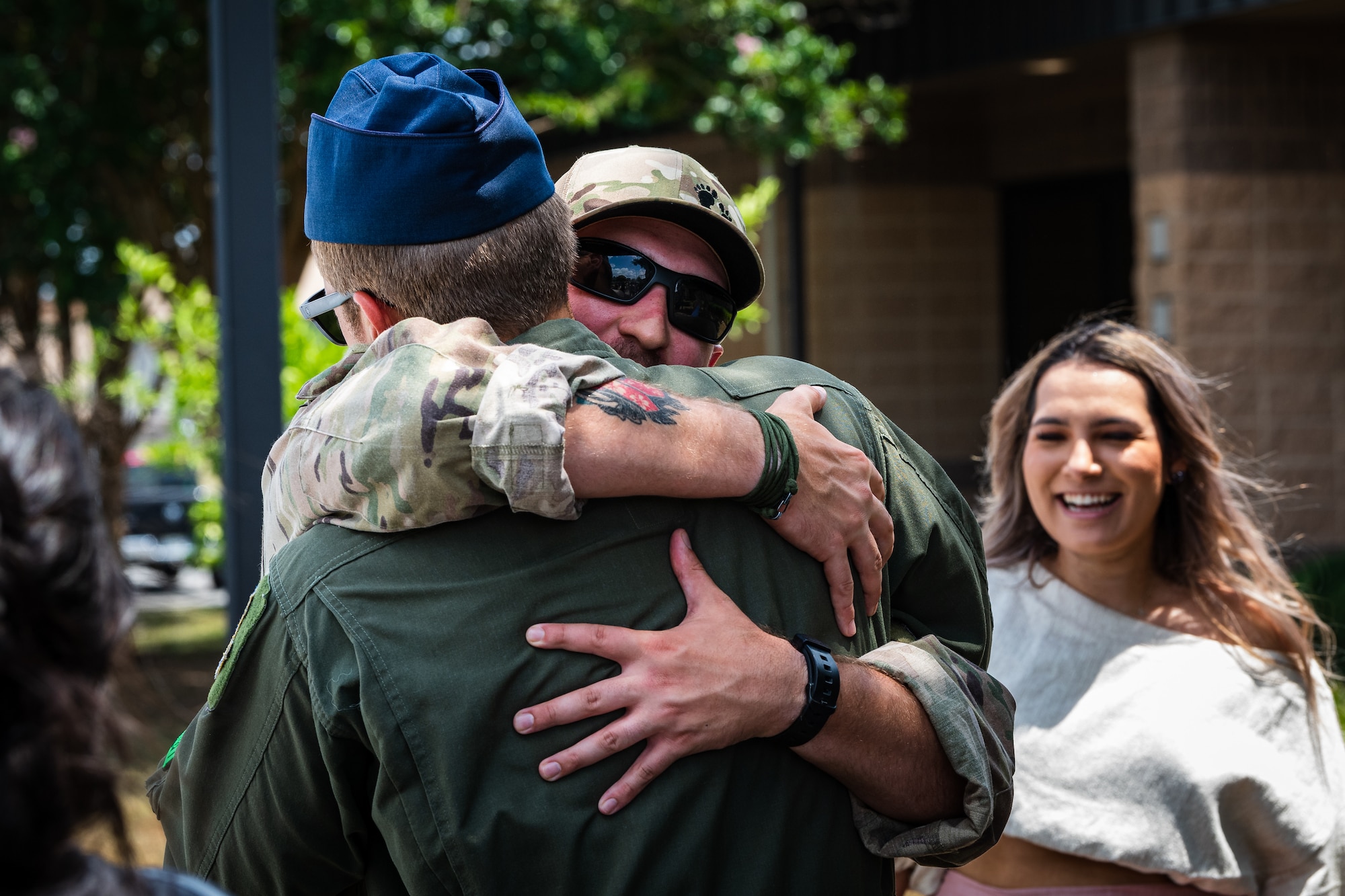 A photo of two Airmen hugging