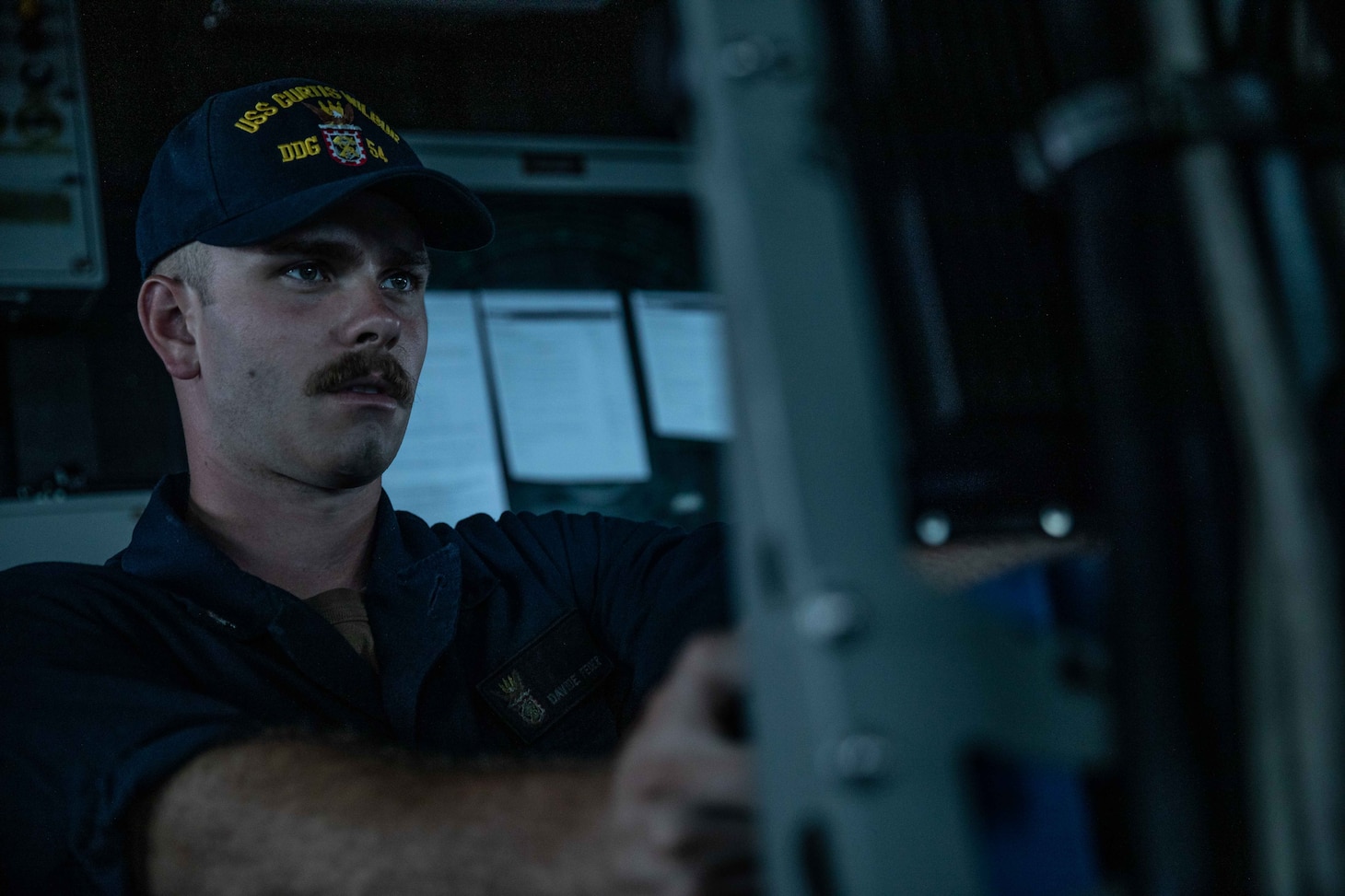 TAIWAN STRAIT (June 22, 2021) – Gunner’s Mate 3rd Class David Feder, from Conroe, Texas, stands watch aboard Arleigh Burke-class guided-missile destroyer USS Curtis Wilbur (DDG 54) as the ship conducts routine operations. Curtis Wilbur is assigned to Commander, Task Force 71/Destroyer Squadron (DESRON) 15, the Navy’s largest forward-deployed DESRON and U.S. 7th Fleet’s principal surface force.