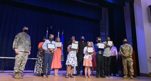 U.S. Army Col. Chesley Thigpen, 733rd Mission Support Group commander, and U.S. Army Sgt. Maj. Muriel Macdonald, 733rd MSG sergeant major, pose for a photo with the class of 2021 Fort Eustis Project SEARCH graduates in the Wylie Theater at Joint Base Langley-Eustis, Virginia.