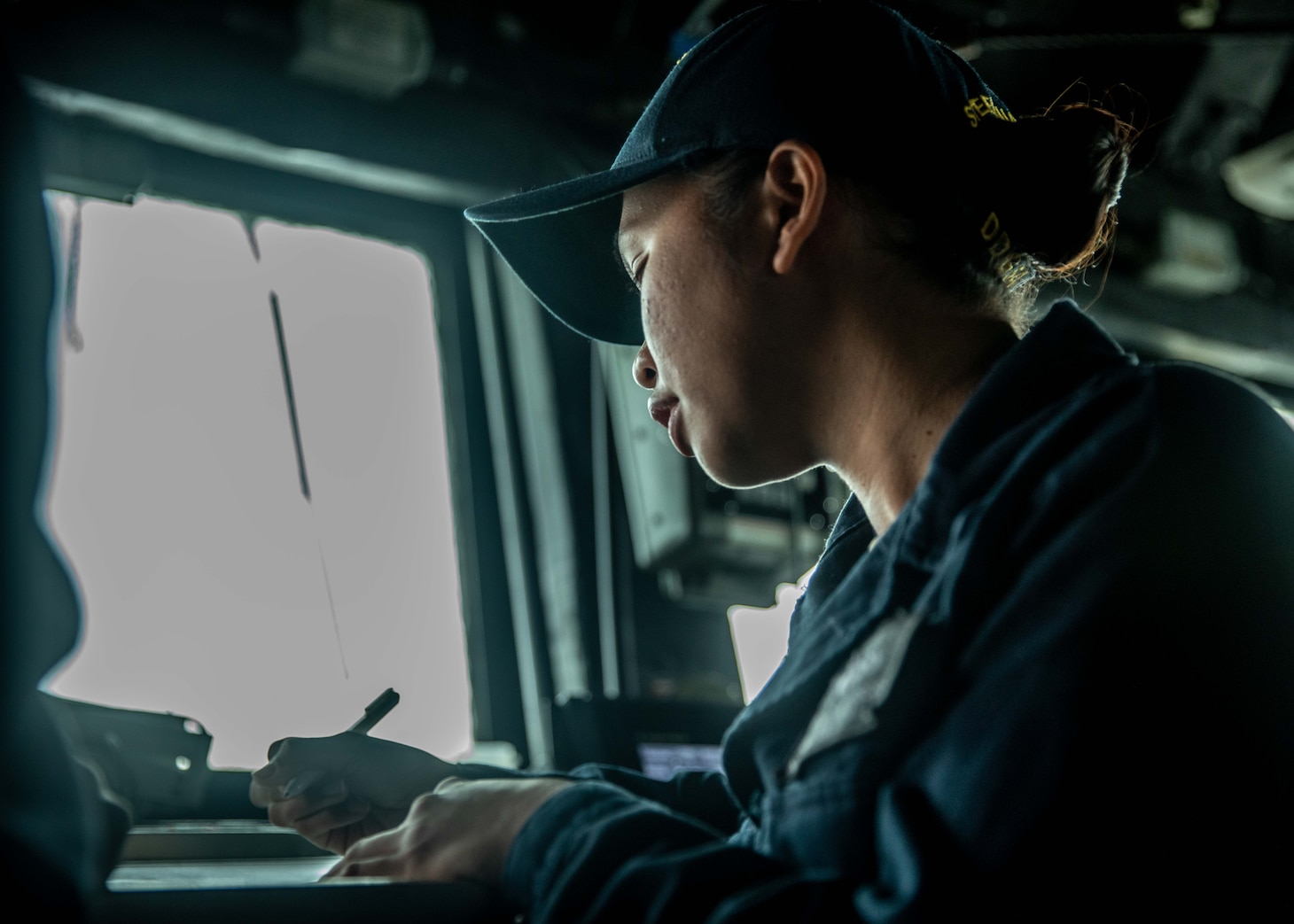 TAIWAN STRAIT (June 22, 2021) – Boatswain’s Mate 2nd Class Cheyenne Moscoso, from Fairfield, Calif., stands watch on the bridge while Arleigh Burke-class guided-missile destroyer USS Curtis Wilbur (DDG 54) as the ship conducts routine operations. Curtis Wilbur is assigned to Commander, Task Force 71/Destroyer Squadron (DESRON) 15, the Navy’s largest forward-deployed DESRON and U.S. 7th Fleet’s principal surface force.