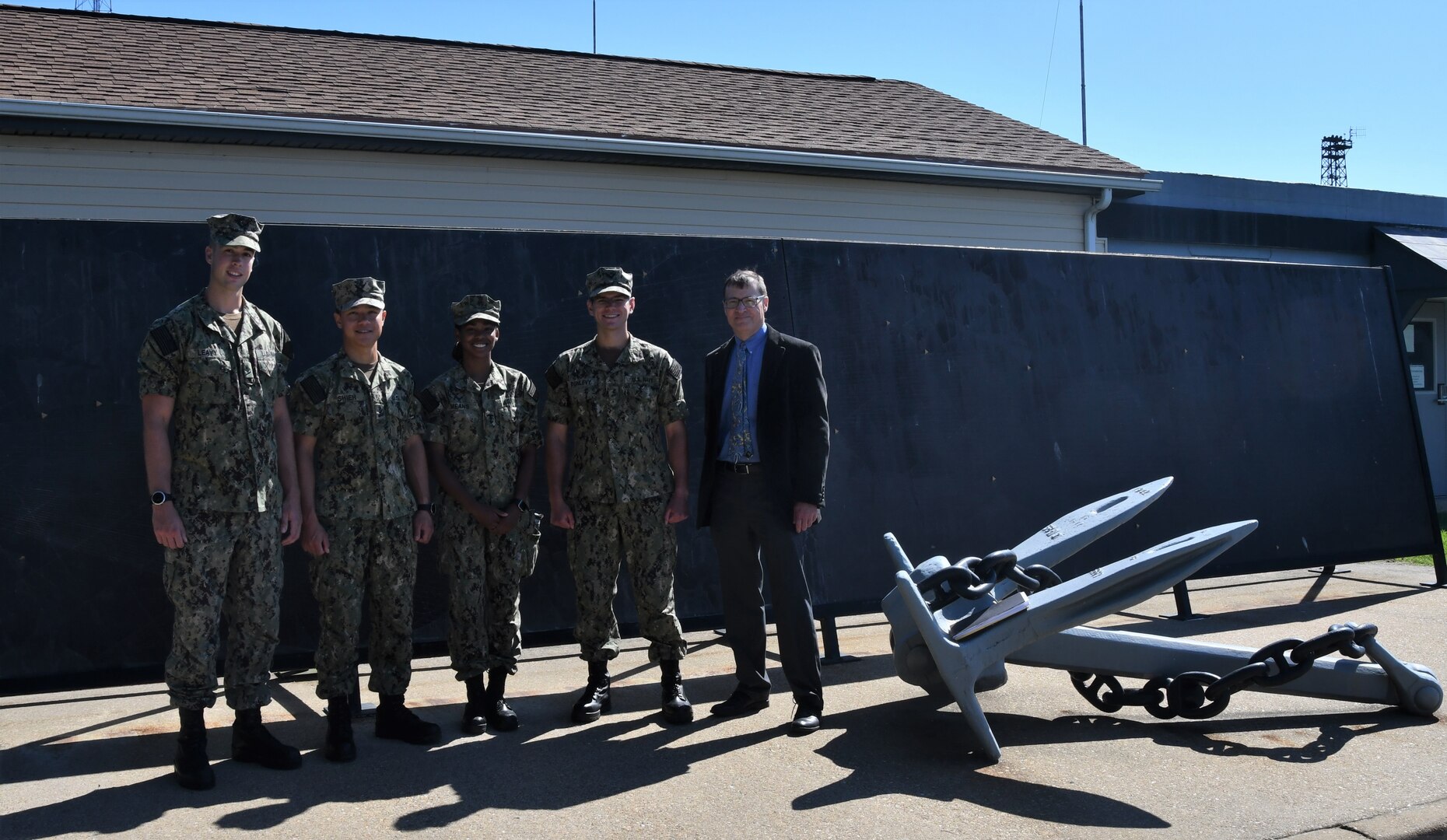 IMAGE: Midshipmen Aidan Leavy, Zach Shieh, Sydney Means and Lian Dunlevy pose for a group photo outside the Potomac River Test Range with Naval Surface Warfare Center (NSWC) Indian Head Scientific and Technical Intelligence Liaison Officer Kenneth Conley. The midshipmen visited NSWC Dahlgren on June 17 to tour facilities and hear briefs on hypersonics, the battle management system and Dahlgren’s role in supporting the warfighter.