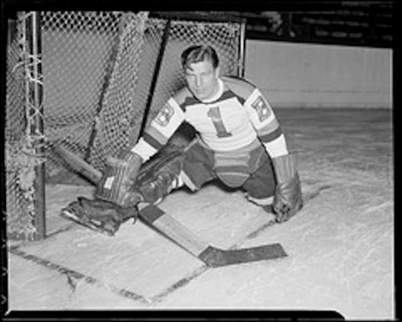 A hockey player takes the ice.